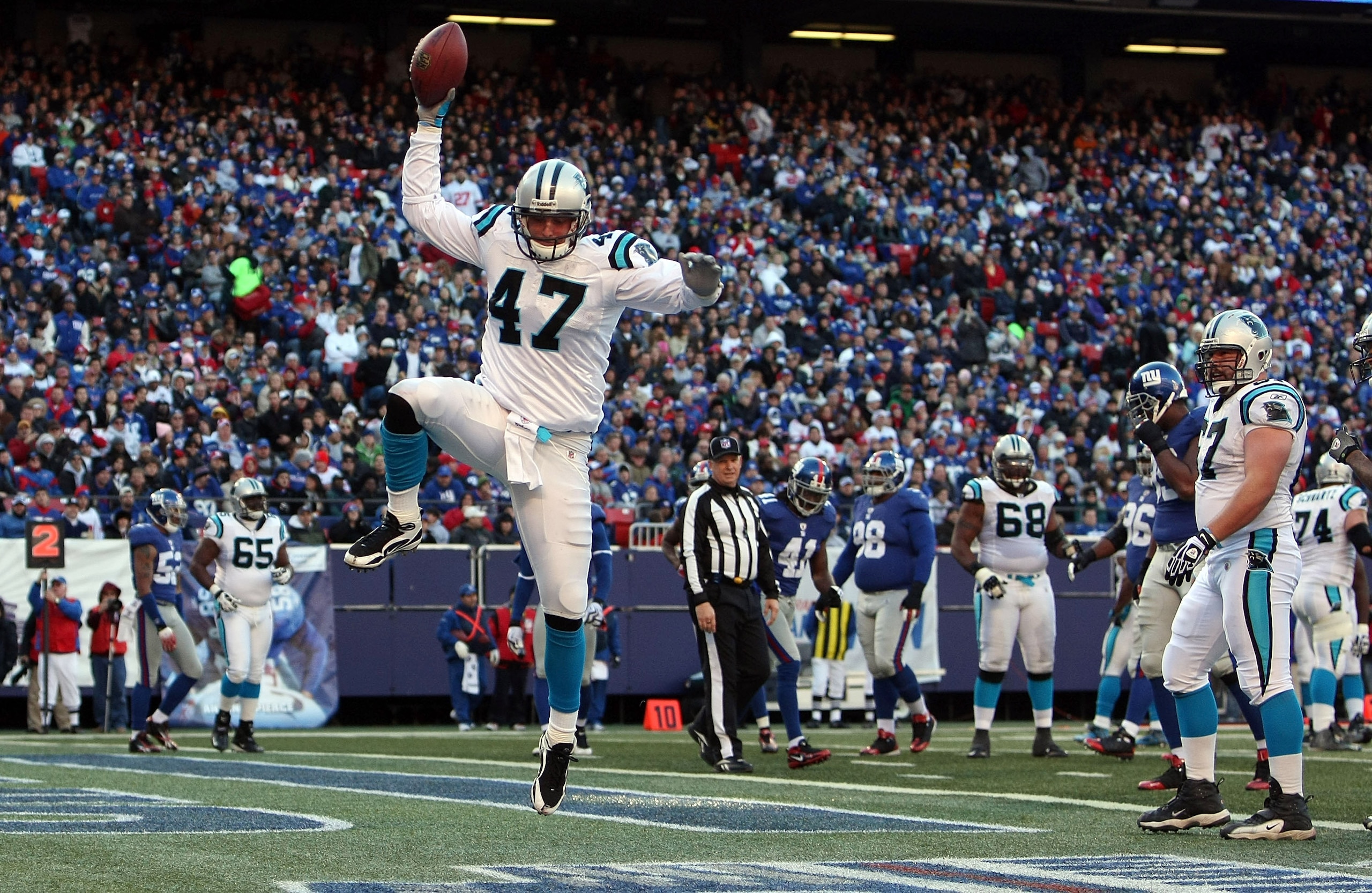 EAST RUTHERFORD, NJ - DECEMBER 27:  Jeff King #47 of the Carolina Panthers celebrates his second quarter touchdown against the New York Giants at Giants Stadium on December 27, 2009 in East Rutherford, New Jersey.  (Photo by Nick Laham/Getty Images)