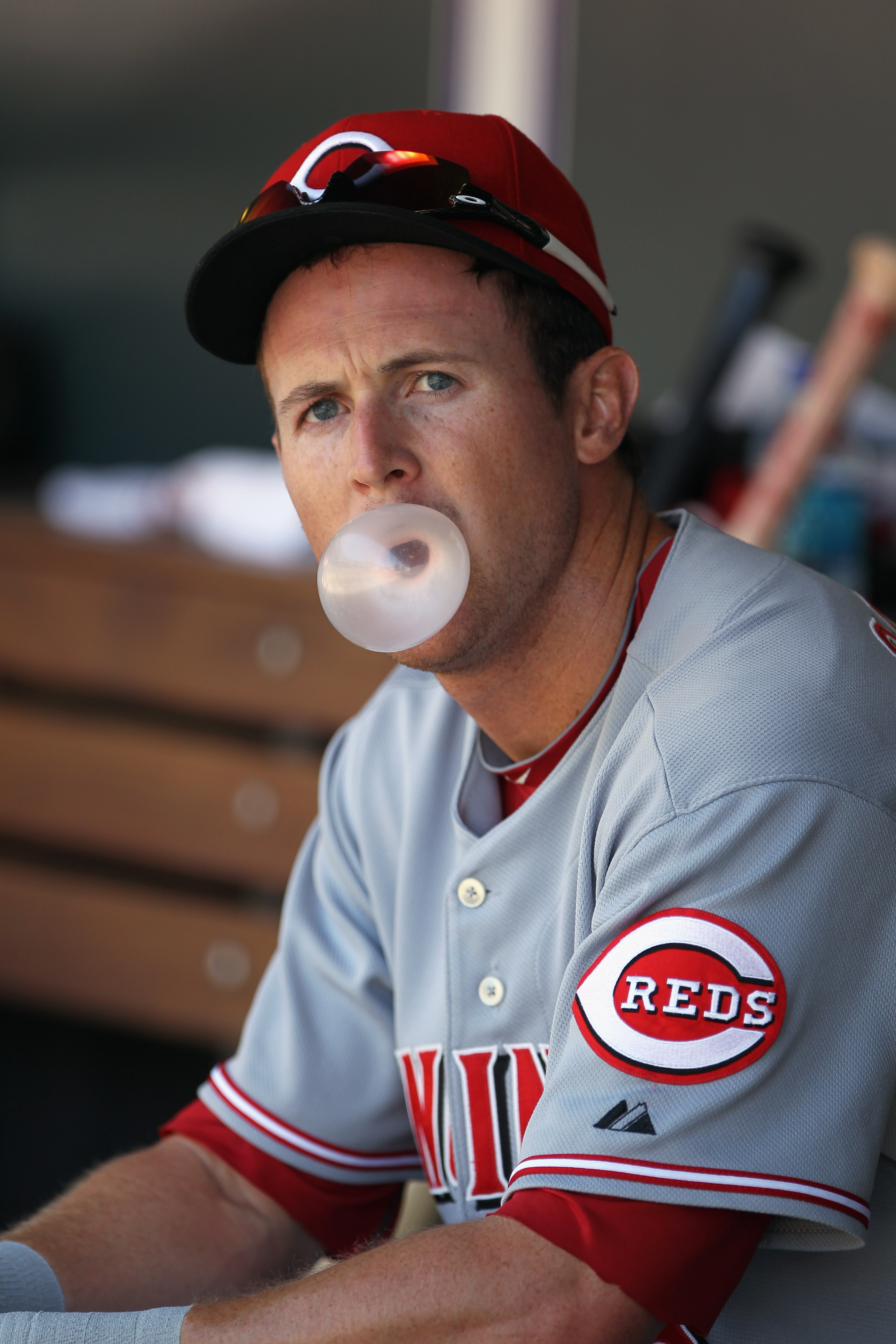 DENVER - SEPTEMBER 06:  Drew Stubbs #6 of the Cincinnati Reds blow his bubble gum as he sits on the dugout bench as he faces the Colorado Rockies at Coors Field on September 6, 2010 in Denver, Colorado.  (Photo by Doug Pensinger/Getty Images)