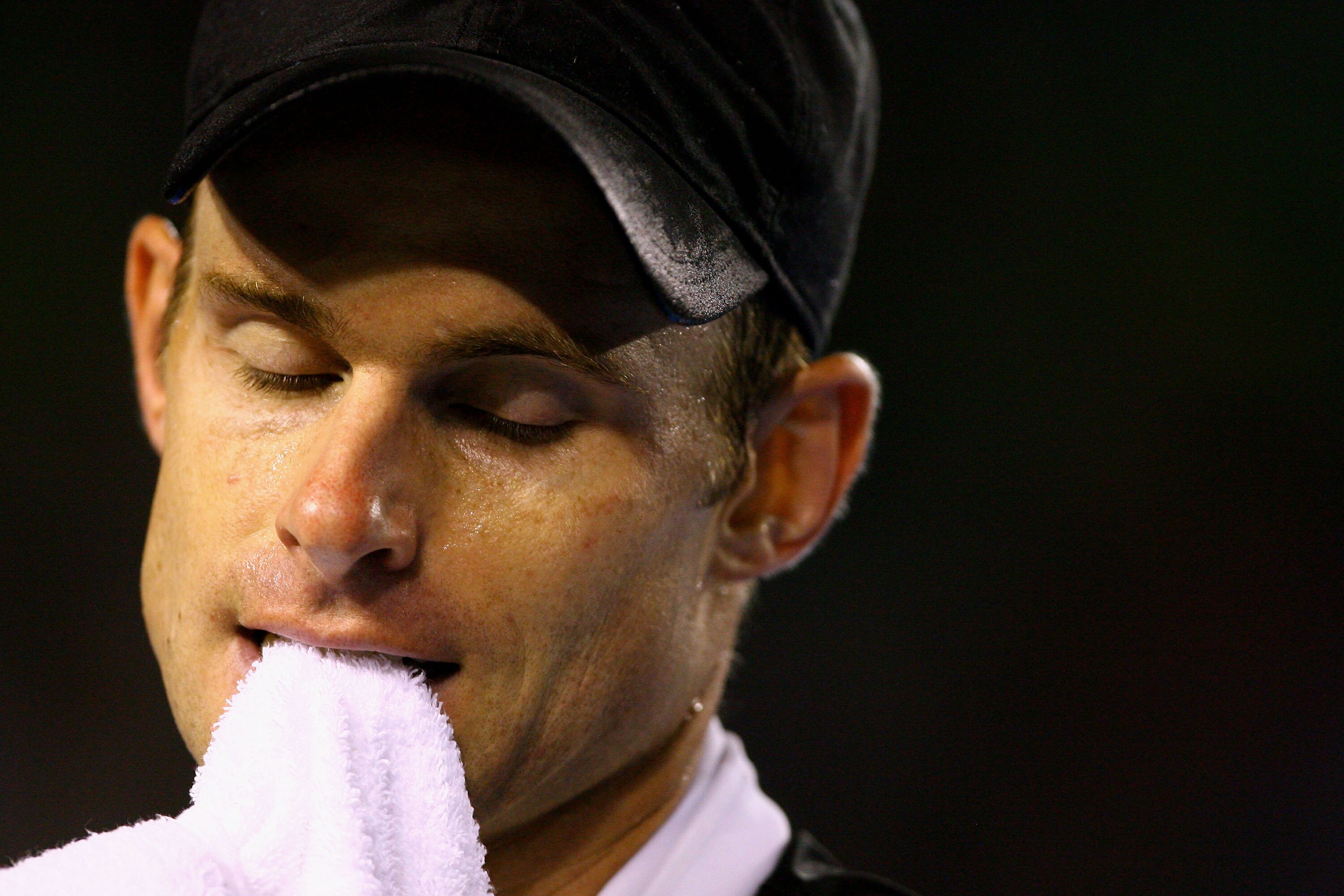 MELBOURNE, AUSTRALIA - JANUARY 23:  Andy Roddick of the United States of America reacts after a shot in his fourth round match against Stanislas Wawrinka of Switzerland during day seven of the 2011 Australian Open at Melbourne Park on January 23, 2011 in