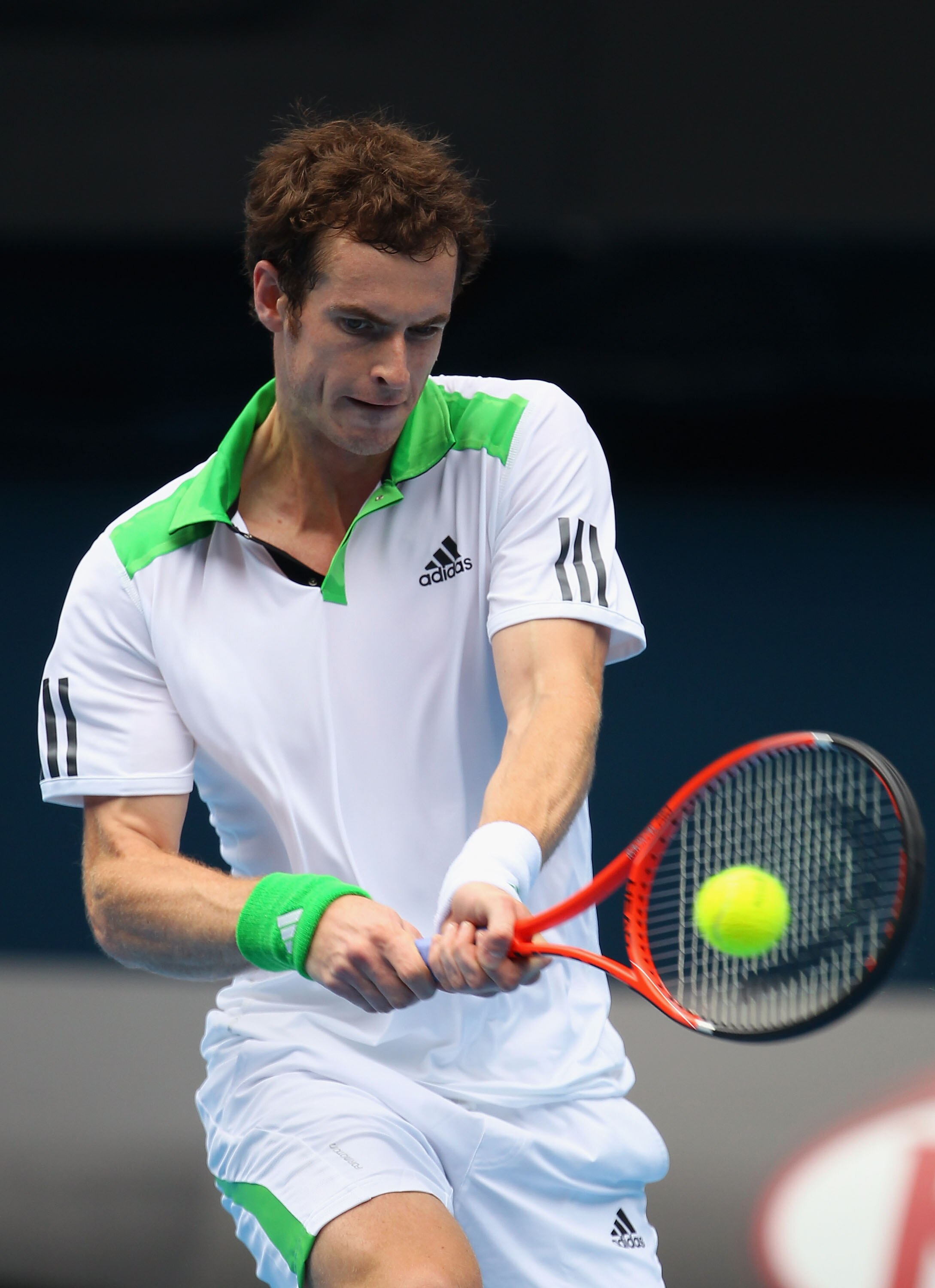 MELBOURNE, AUSTRALIA - JANUARY 26:  Andy Murray of Great Britain plays a backhand in his quarterfinal match against Alexandr Dolgopolov of the Ukraine during day ten of the 2011 Australian Open at Melbourne Park on January 26, 2011 in Melbourne, Australia