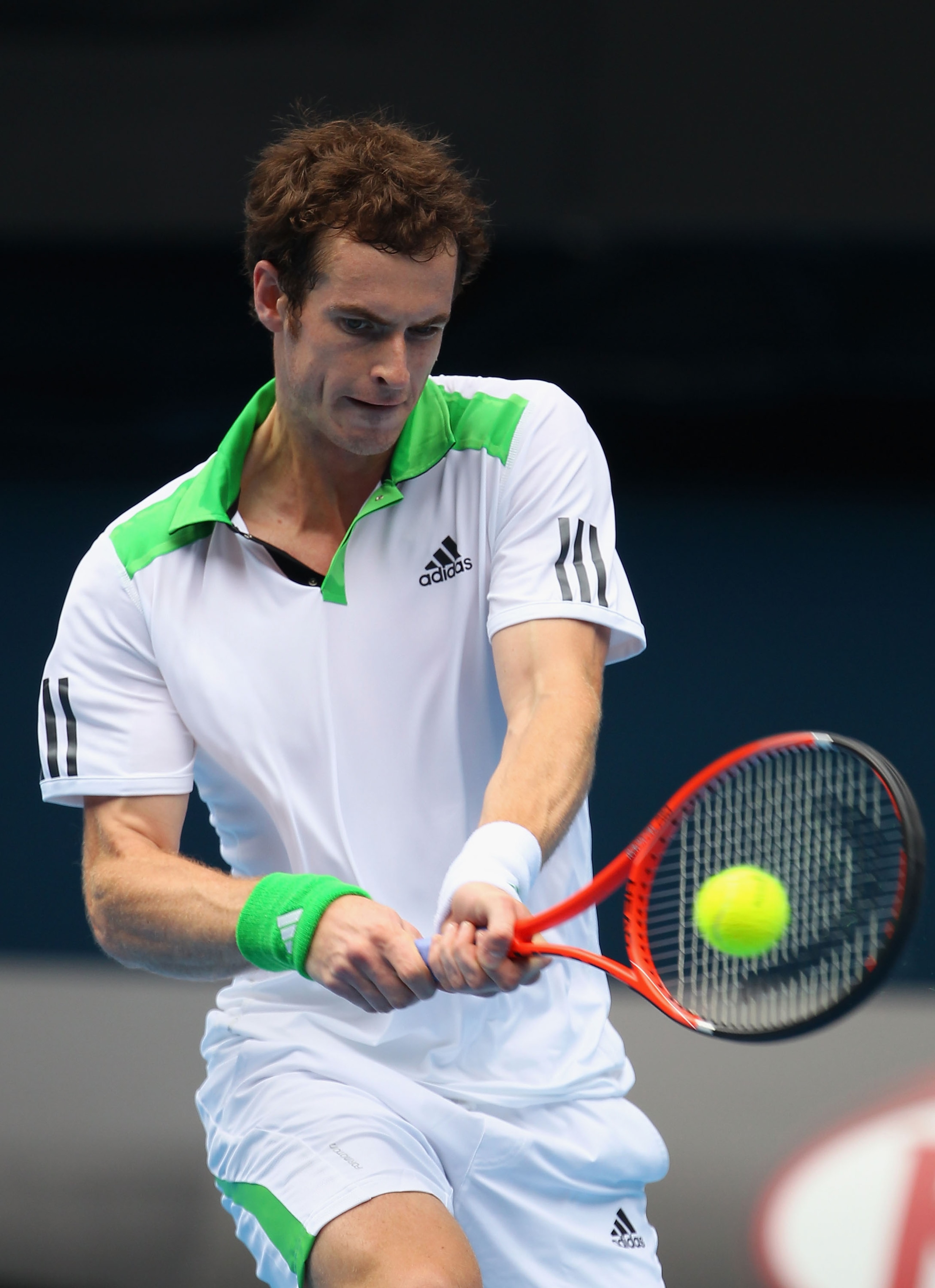 MELBOURNE, AUSTRALIA - JANUARY 26:  Andy Murray of Great Britain plays a backhand in his quarterfinal match against Alexandr Dolgopolov of the Ukraine during day ten of the 2011 Australian Open at Melbourne Park on January 26, 2011 in Melbourne, Australia