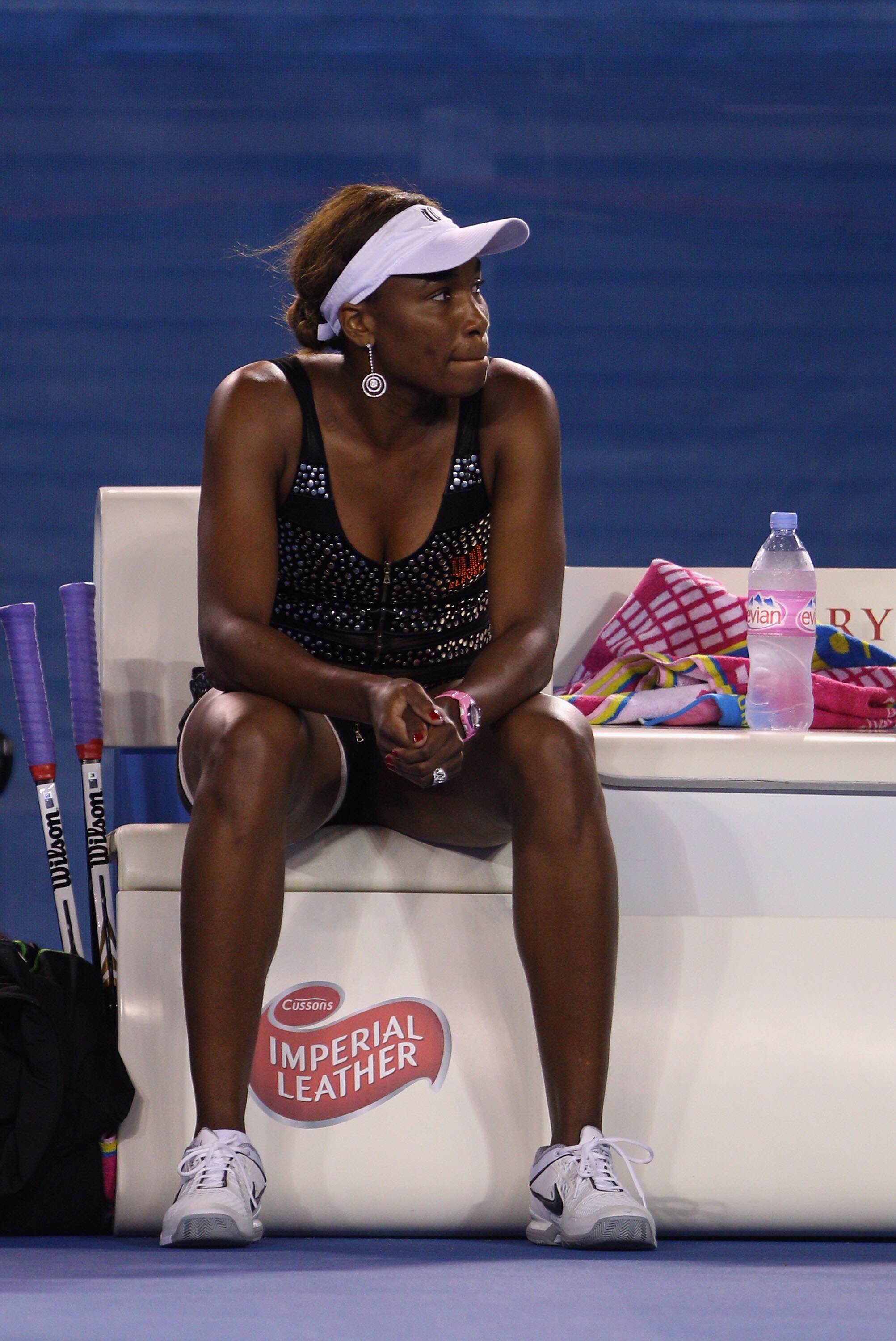 MELBOURNE, AUSTRALIA - JANUARY 21:  Venus Williams of the United States of America looks on as she retires hurt due to injury in her third round match against Andrea Petkovic of Germany during day five of the 2011 Australian Open at Melbourne Park on Janu