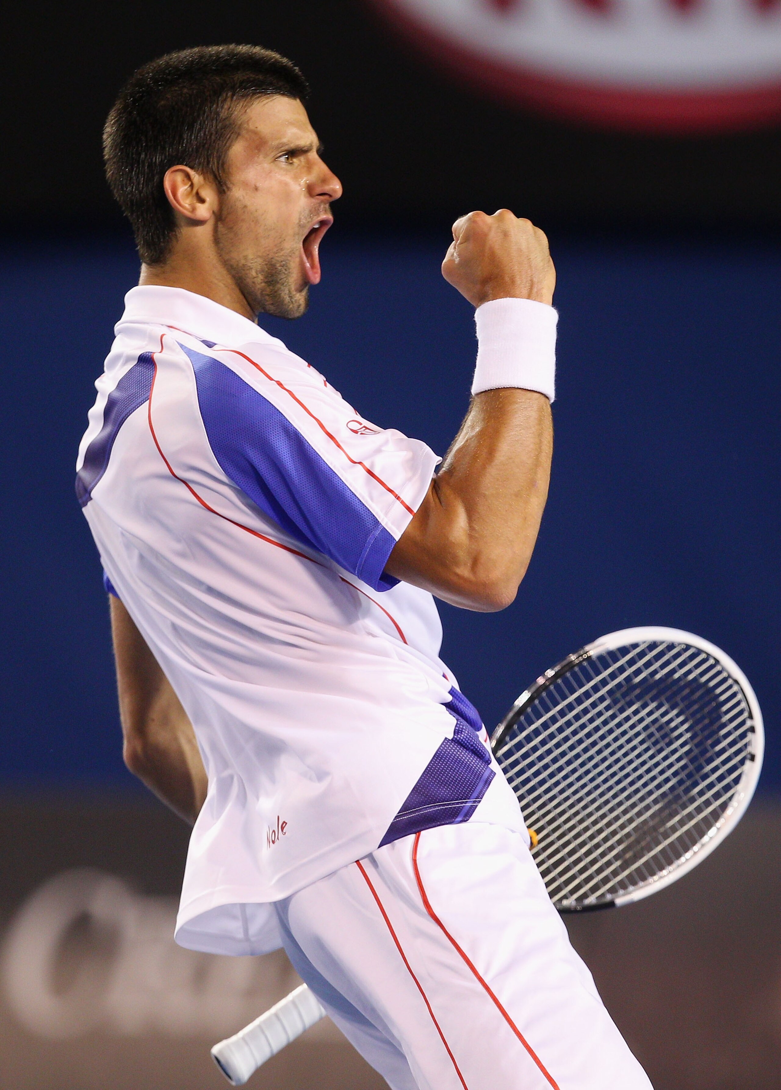 MELBOURNE, AUSTRALIA - JANUARY 25:  Novak Djokovic of Serbia celebrates winning a break point in his quarterfinal match against Tomas Berdych of the Czech Republic  during day nine of the 2011 Australian Open at Melbourne Park on January 25, 2011 in Melbo