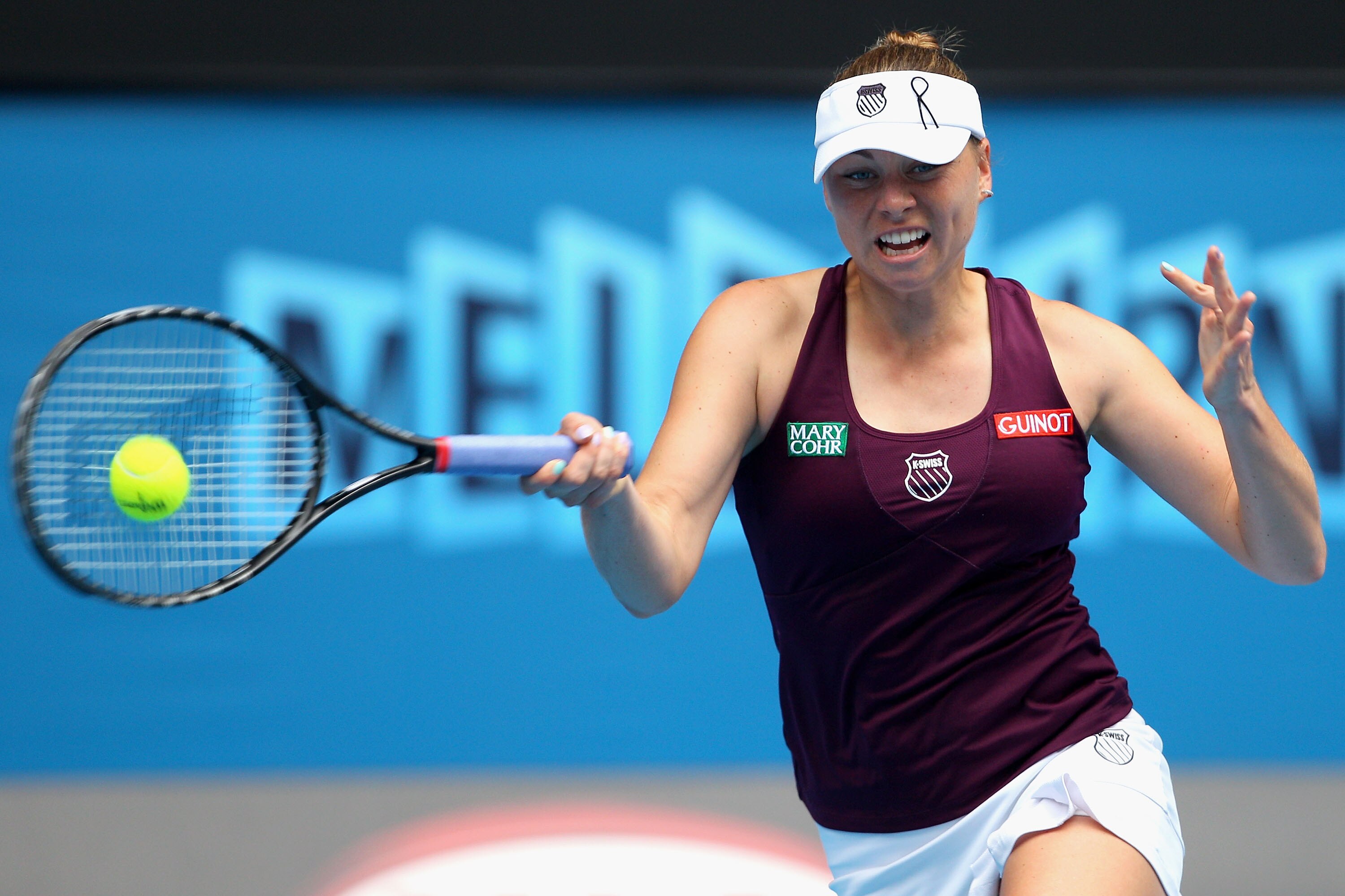 MELBOURNE, AUSTRALIA - JANUARY 26:  Vera Zvonareva of Russia plays a forehand in her quarterfinal match against Petra Kvitova of the Czech Republic during day ten of the 2011 Australian Open at Melbourne Park on January 26, 2011 in Melbourne, Australia.