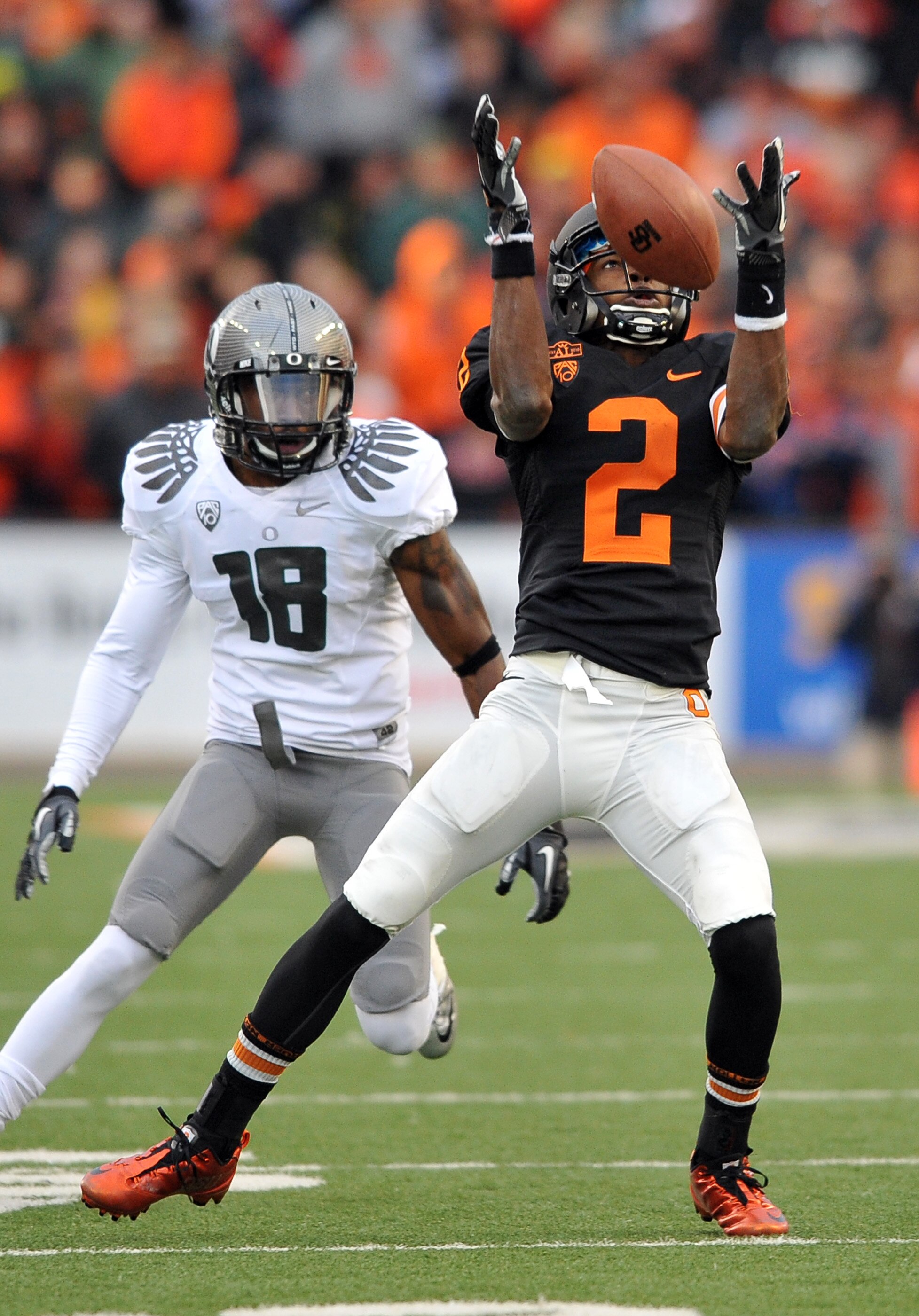 CORVALLIS, OR - DECEMBER 4: Markus Wheaton #2 of the Oregon State Beavers corrals a pass reception as Anthony Gildon #18 of the Oregon Ducks closes in during the fourth quarter of the game at Reser Stadium on December 4, 2010 in Corvallis, Oregon. The Duc