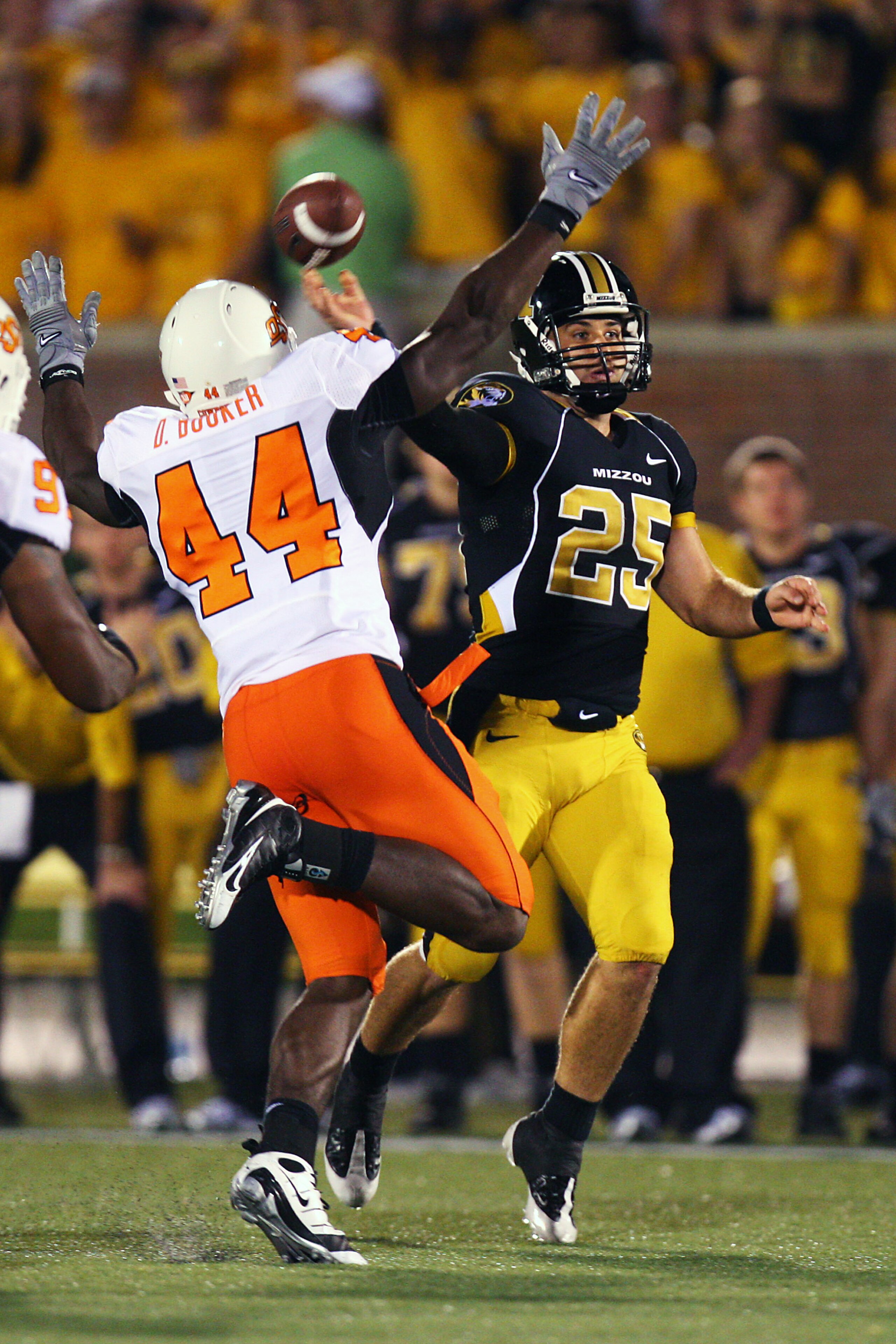 COLUMBIA, MO - OCTOBER 11:  Chase Daniel #25 of the Missouri Tigers throws a pass under pressure from Donald Boooker #44 of the Oklahoma State Cowboys on October 11, 2008 at Memorial Stadium in Columbia, Missouri.  Daniel was wearing #25 in honor of Aaron