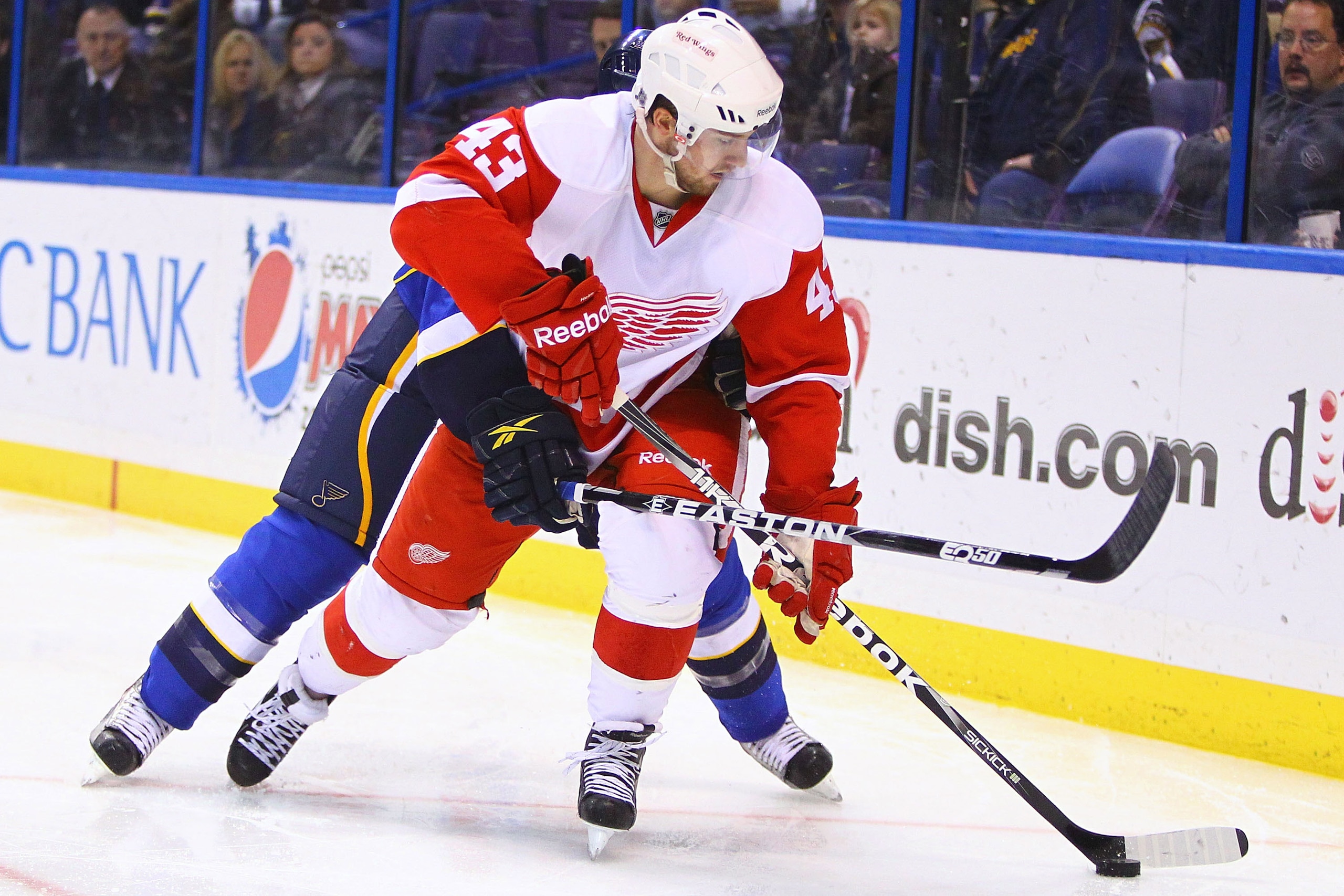 ST. LOUIS, MO - JANUARY 20: Darren Helm #43 of the Detroit Red Wings controls the puck against the St. Louis Blues at the Scottrade Center on January 20, 2011 in St. Louis, Missouri.  (Photo by Dilip Vishwanat/Getty Images)