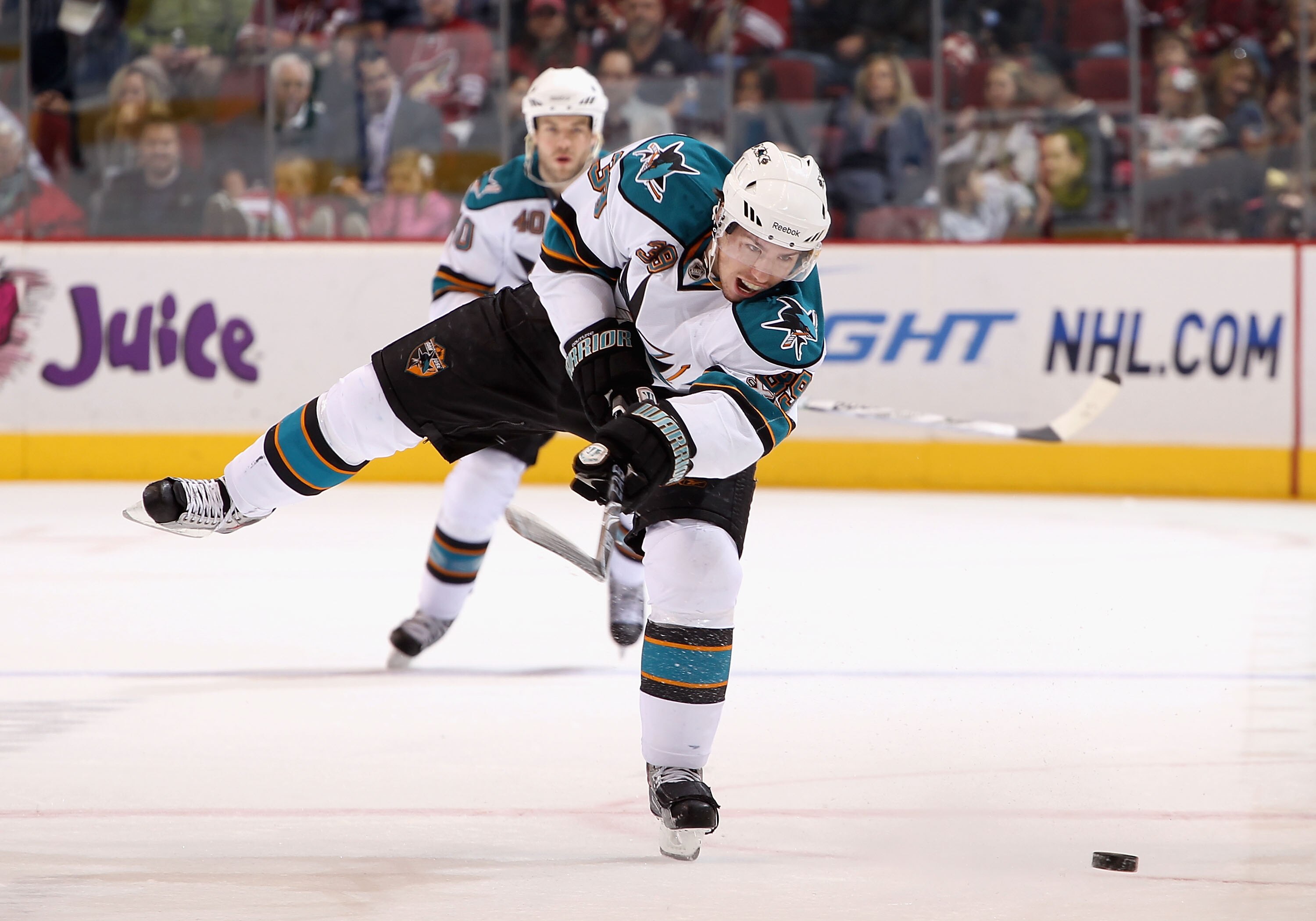 GLENDALE, AZ - JANUARY 17:  Logan Couture #39 of the San Jose Sharks shoots the puck against the Phoenix Coyotes during the NHL game at Jobing.com Arena on January 17, 2011 in Glendale, Arizona.  The Sharks defeated the Coyotes 4-2.  (Photo by Christian P
