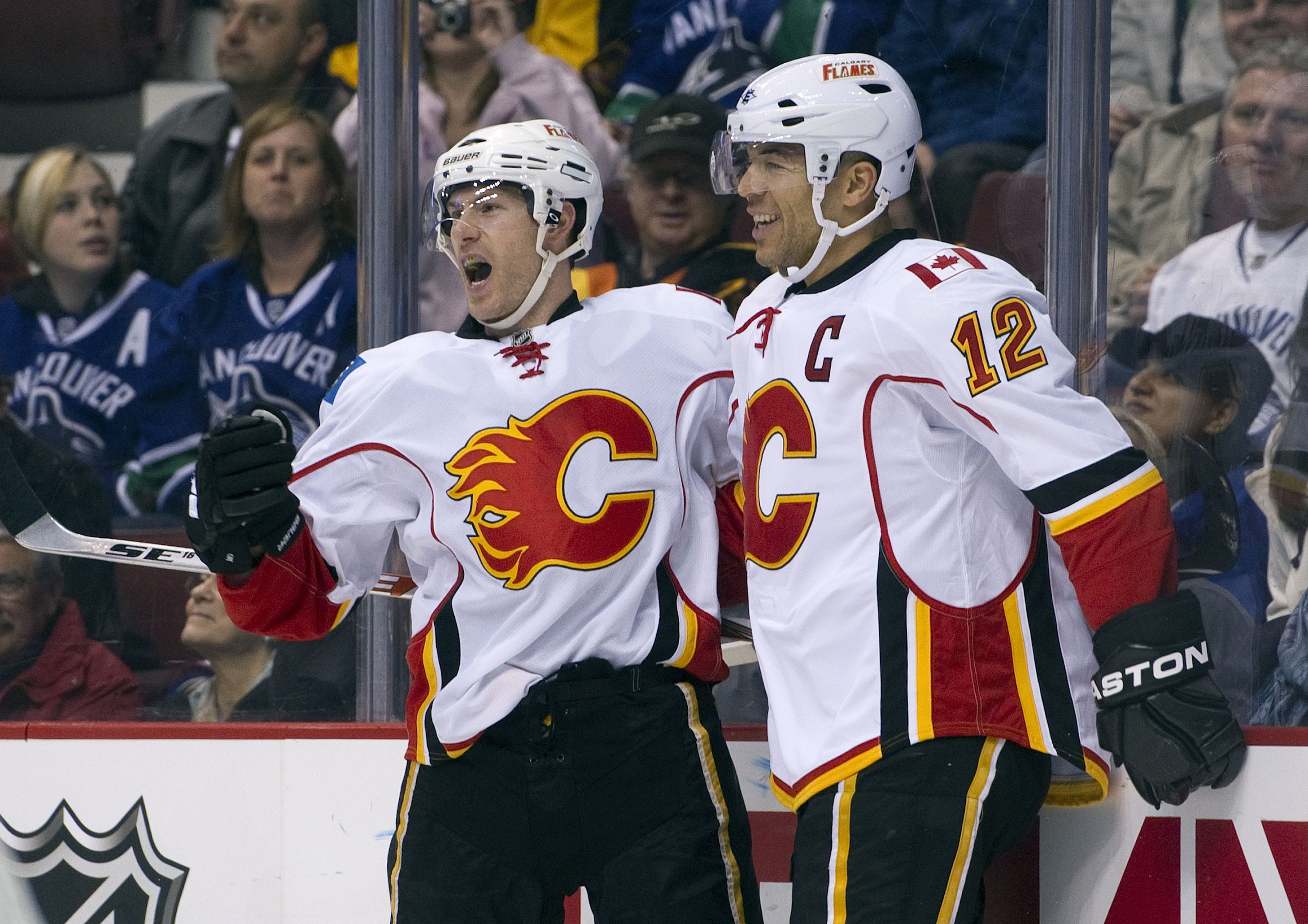 VANCOUVER, CANADA - JANUARY 22: Brendan Morrison #8 of the Calgary Flames celebrates with teammate Jarome Iginla #12 after scoring against the Vancouver Canucks during the first period in NHL action on January 22, 2011 at Rogers Arena in Vancouver, Britis