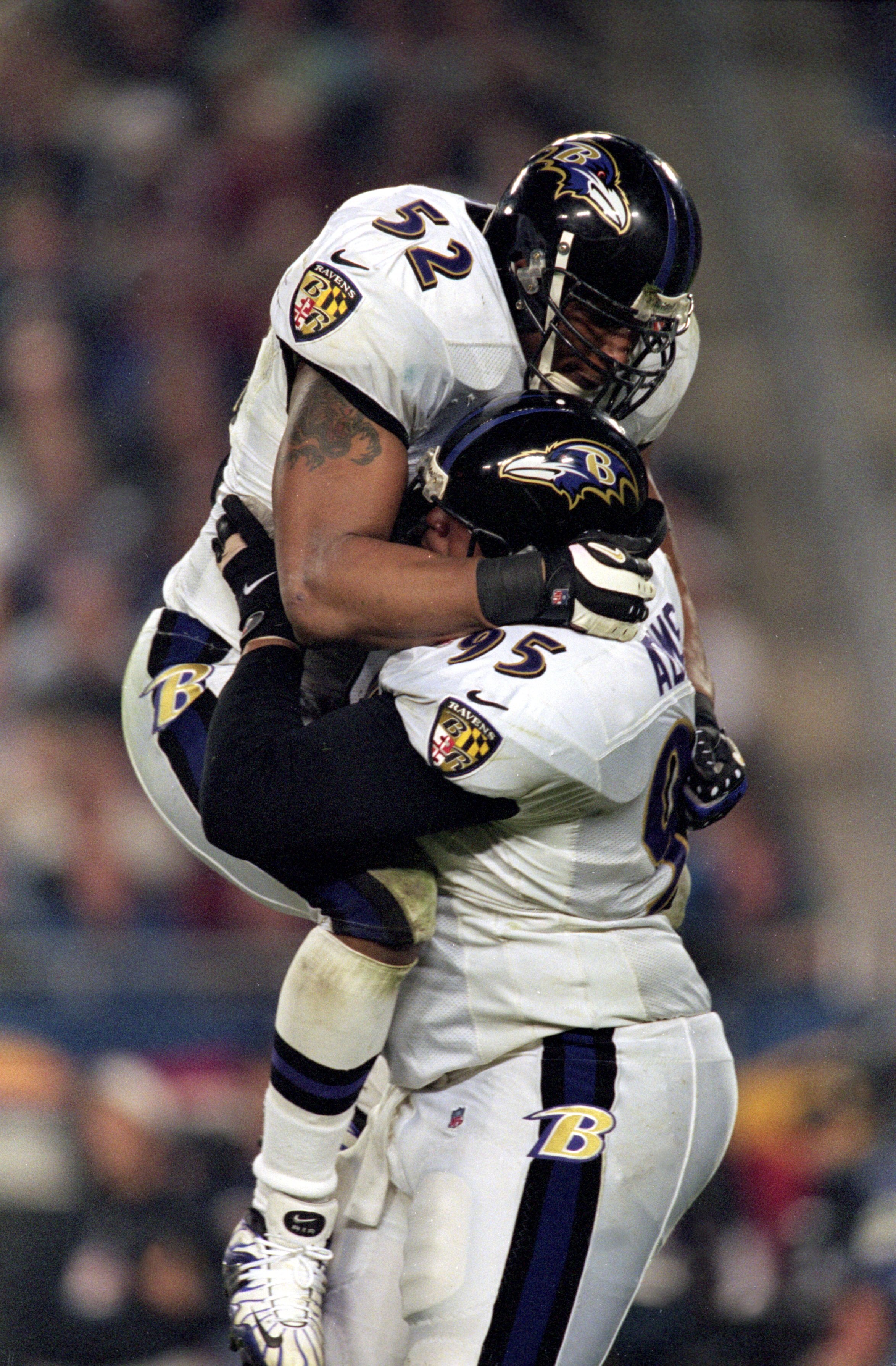 28 Jan 2001: Ray Lewis #52 of the Baltimore Ravens leaps up and hugs teammate Sam Adams #95 after the Super Bowl XXXV Game against the New York Giants at the Raymond James Stadium in Tampa, Florida. The Ravens defeated the Giants 34-7.Mandatory Credit: A 28 Jan 2001: Ray Lewis #52 of the Baltimore Ravens leaps up and hugs teammate Sam Adams #95 after the Super Bowl XXXV Game against the New York Giants at the Raymond James Stadium in Tampa, Florida. The Ravens defeated the Giants 34-7.Mandatory Credit: A
