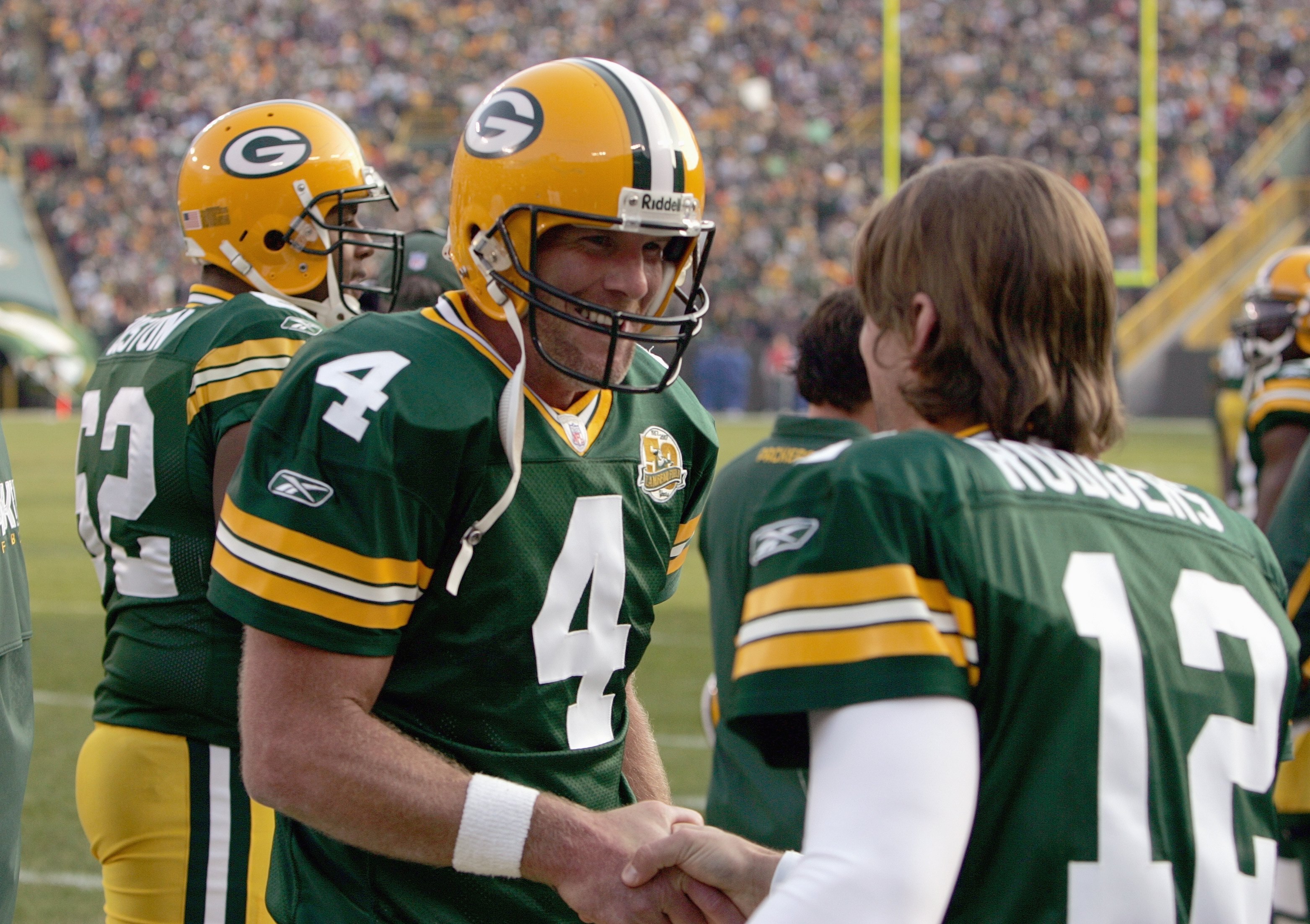 GREEN BAY, WI - NOVEMBER 11: Brett Favre #4 of the Green Bay Packers talks with  Aaron Rodgers #12 during the game against the Minnesota Vikings give chase on November 11, 2007 at Lambeau Field in Green Bay, Wisconsin. (Photo by Jonathan Daniel/Getty Imag