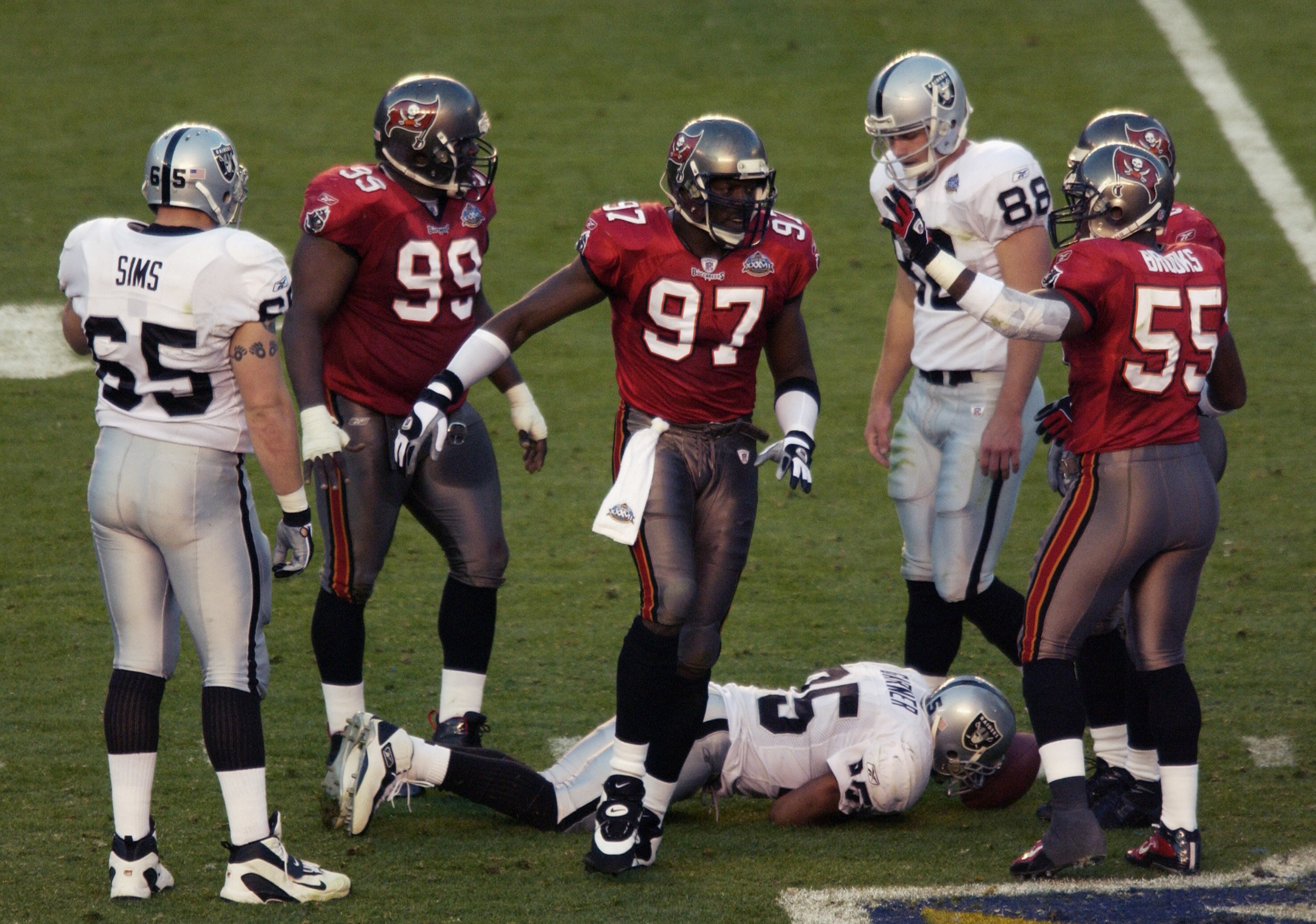 SAN DIEGO - JANUARY 26: Simeon Rice #97 of the Tampa Bay Buccaneers gets a high five from teammate Derrick Brooks #55 after tackling Charlie Garner #25 of the Oakland Raiders during Super Bowl XXXVII on January 26, 2003 at Qualcomm Stadium in San Diego, SAN DIEGO - JANUARY 26: Simeon Rice #97 of the Tampa Bay Buccaneers gets a high five from teammate Derrick Brooks #55 after tackling Charlie Garner #25 of the Oakland Raiders during Super Bowl XXXVII on January 26, 2003 at Qualcomm Stadium in San Diego,