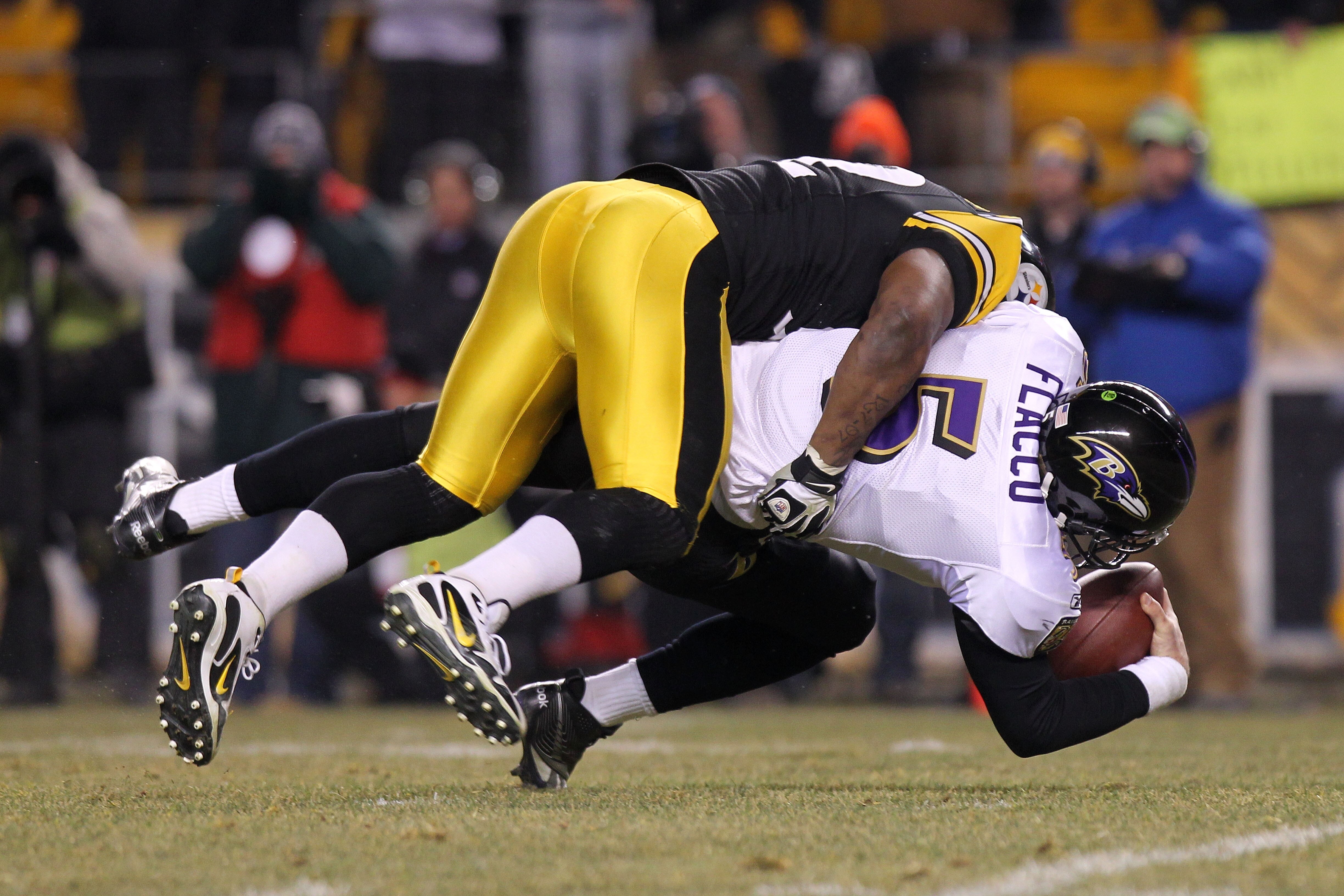 PITTSBURGH, PA - JANUARY 15:  Linebacker James Harrison #92 of the Pittsburgh Steelers sacks quarterback Joe Flacco #5 of the Baltimore Ravens during the AFC Divisional Playoff Game at Heinz Field on January 15, 2011 in Pittsburgh, Pennsylvania.  (Photo b