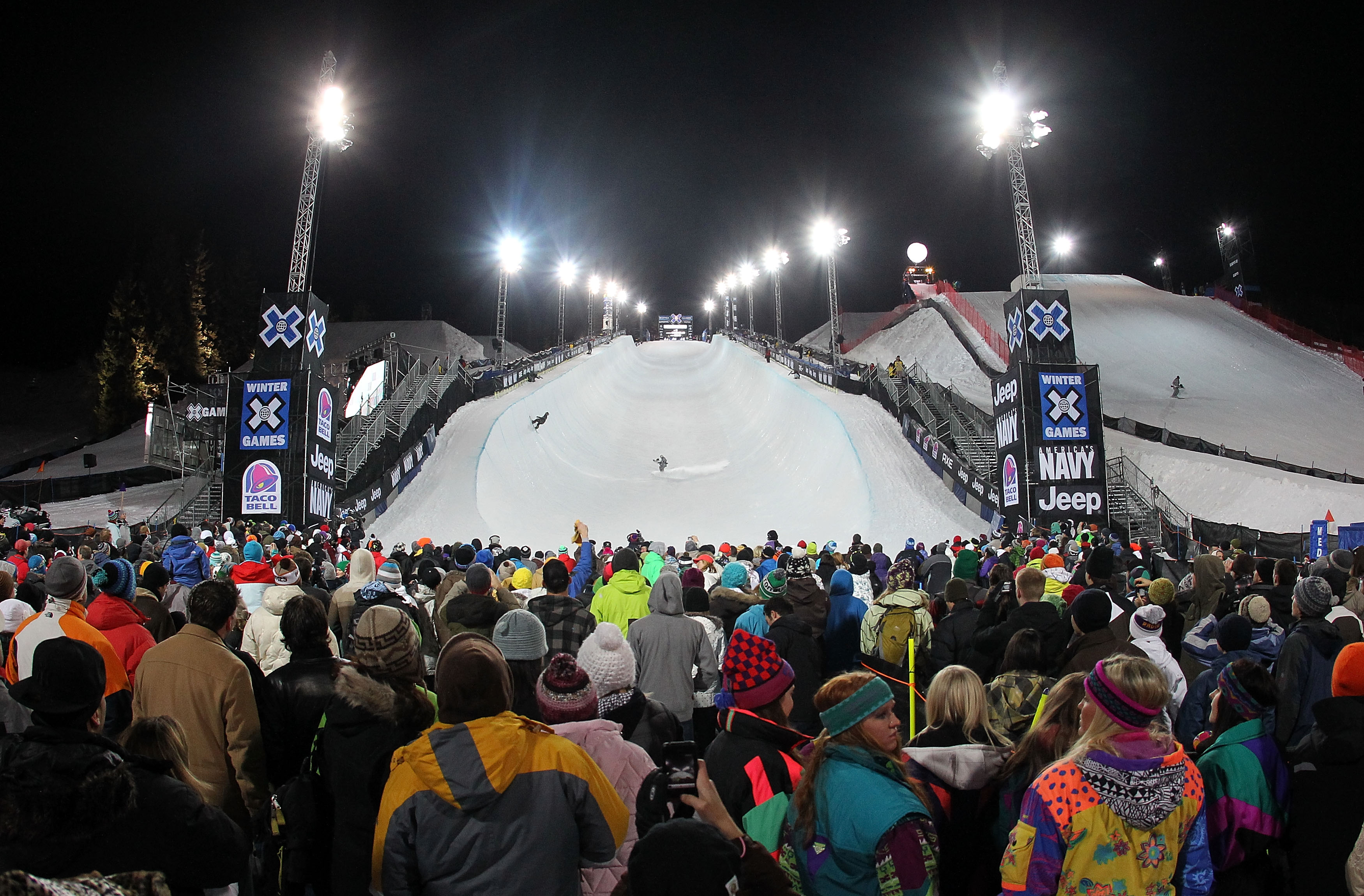 ASPEN, CO - JANUARY 28:  Spectators gather at the bottom of the halfpipe for Men's Snowboard Superpipe Eliminations at Winter X Games 14 at Buttermilk Mountain on January 28, 2010 in Aspen, Colorado.  (Photo by Doug Pensinger/Getty Images)