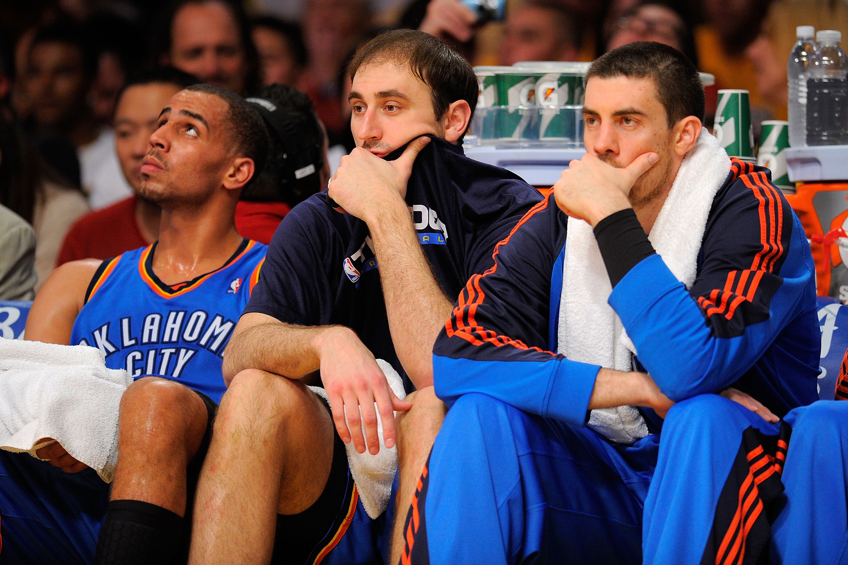 LOS ANGELES, CA - APRIL 27:  Thabo Sefolosha #2, Nenad Krstic #12 and Nick Collison #4 of the Oklahoma City Thunder sit on the bench in the second half while taking on the Los Angeles Lakers during Game Five of the Western Conference Quarterfinals of the