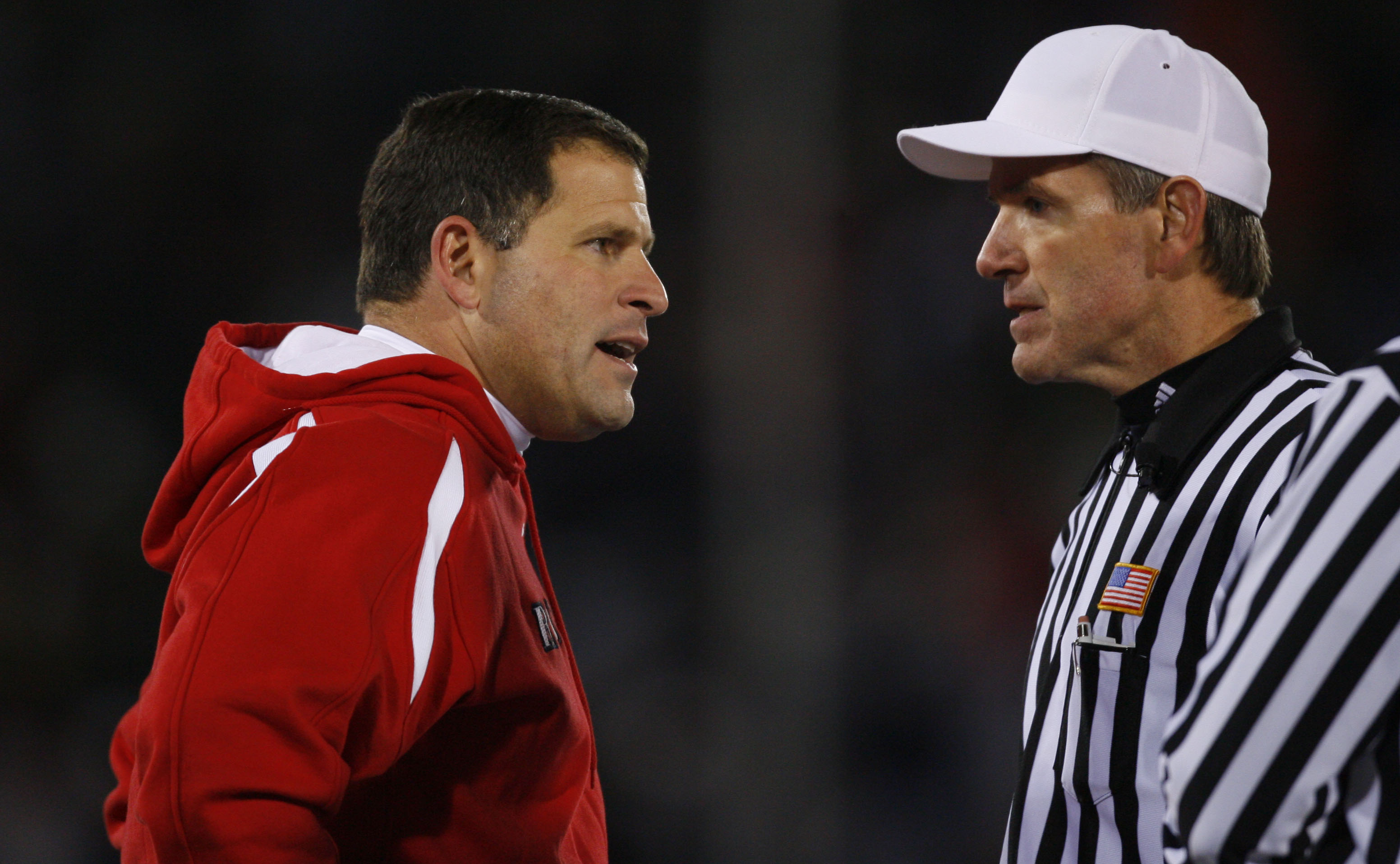 EAST HARTFORD, CT - NOVEMBER 3:  Coach Greg Schiano (L) of the Rutgers Scarlet Kinghts has words with an official during a game against the University of Connecticut Huskies at Rentschler Field November 3, 2007 in East Hartford, Connecticut.  (Photo by Ji