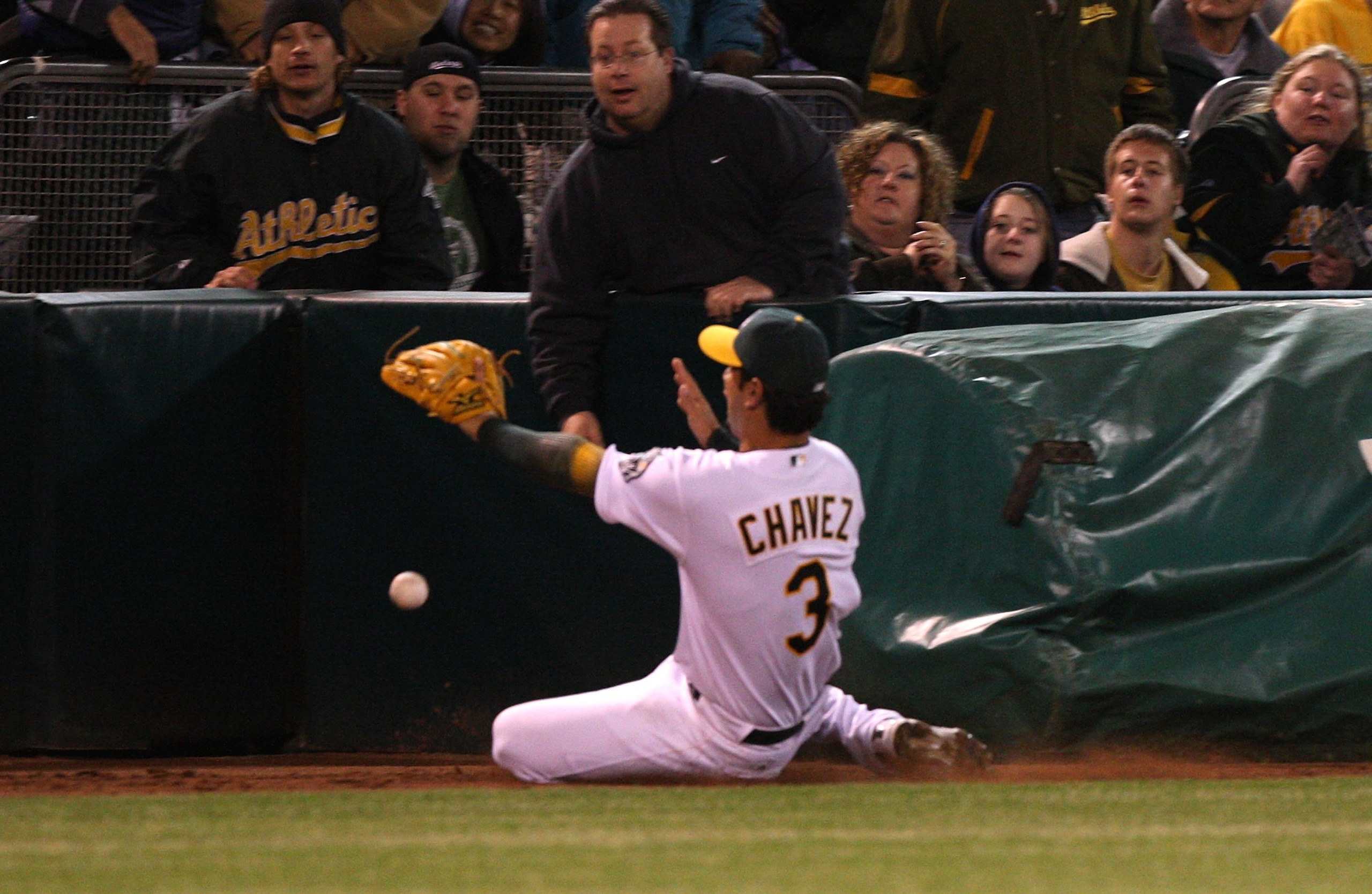 OAKLAND, CA - APRIL 10:  Eric Chavez #3 of the Oakland Athletics misses a foul ball against the Seattle Mariners during Opening Day at a Major League Baseball game on April 10, 2009 at the Oakland Coliseum in Oakland, California.  (Photo by Jed Jacobsohn/