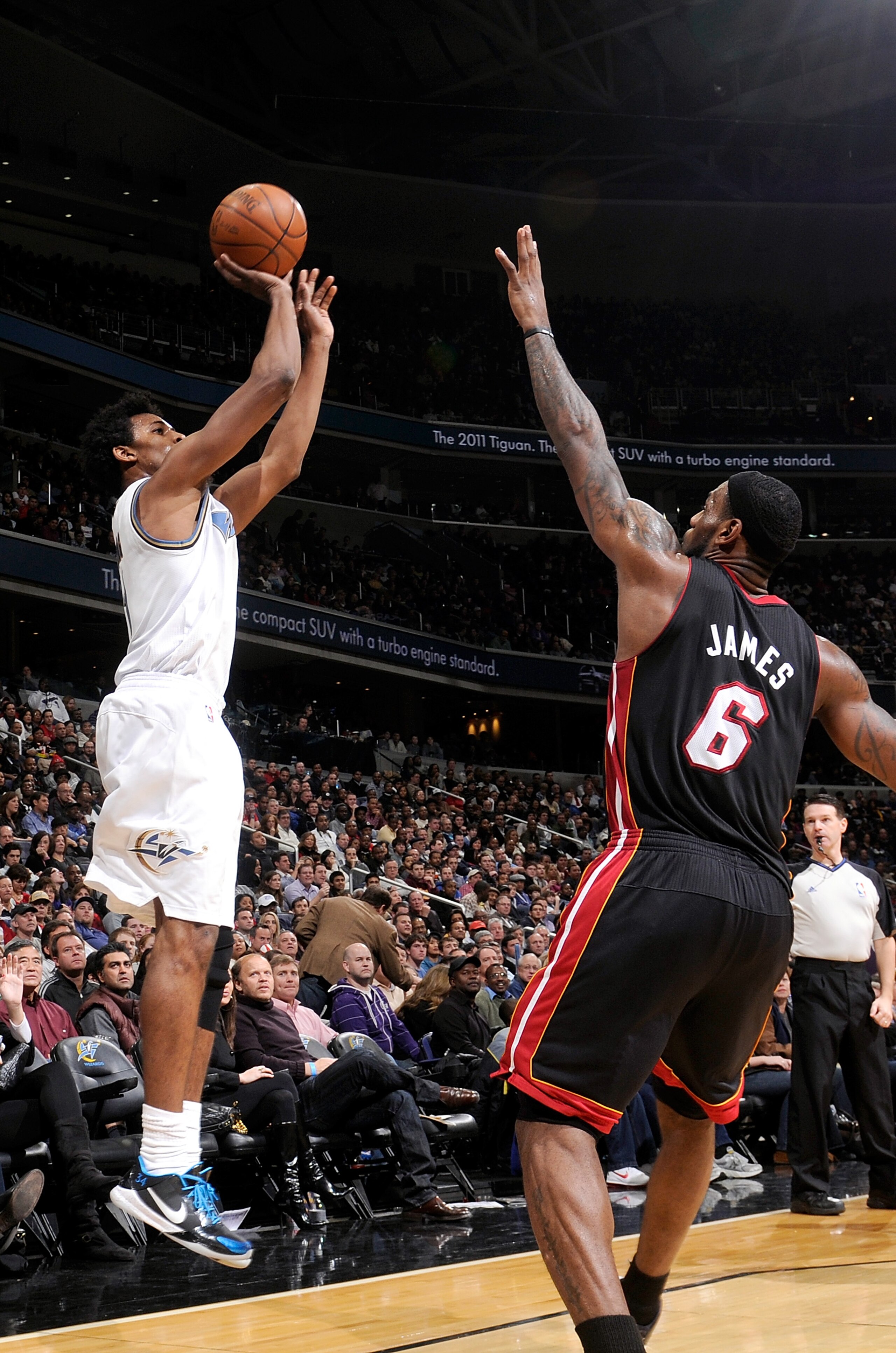 WASHINGTON, DC - DECEMBER 18: Nick Young #1 of the Washington Wizards shoots over Lebron James #6 of the Miami Heat at the Verizon Center on December 18, 2010 in Washington, DC. NOTE TO USER: User expressly acknowledges and agrees that, by downloading an WASHINGTON, DC - DECEMBER 18: Nick Young #1 of the Washington Wizards shoots over Lebron James #6 of the Miami Heat at the Verizon Center on December 18, 2010 in Washington, DC. NOTE TO USER: User expressly acknowledges and agrees that, by downloading an