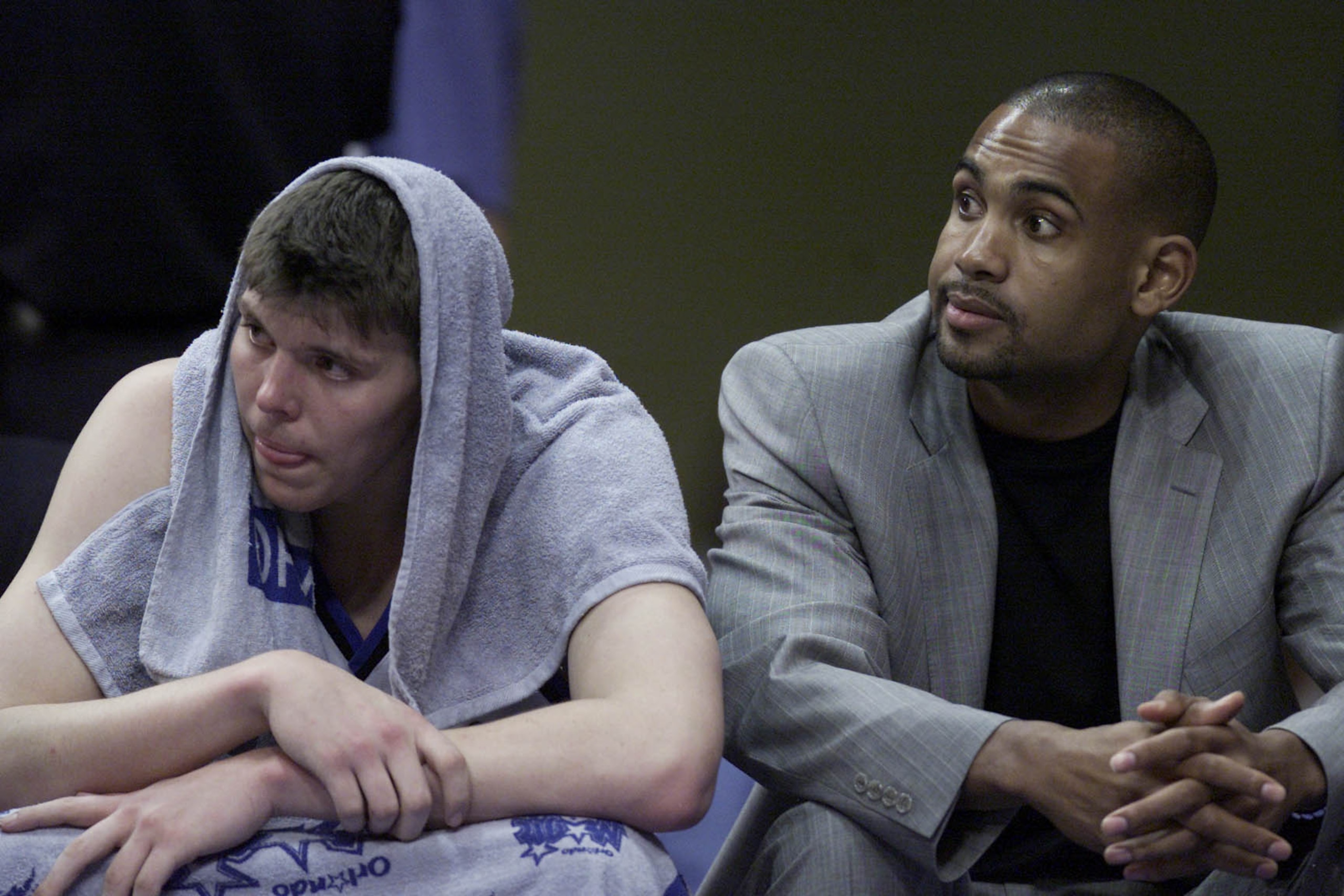 1 May 2001:  Mike Miller #50 and Grant Hill of the Orlando Magic watch from the bench during game four of round one in the NBA playoffs against the Orlando Magic at the TD Waterhouse in Orlando, Florida.  The Bucks won 112-104 to take the series 3-1.  DIG