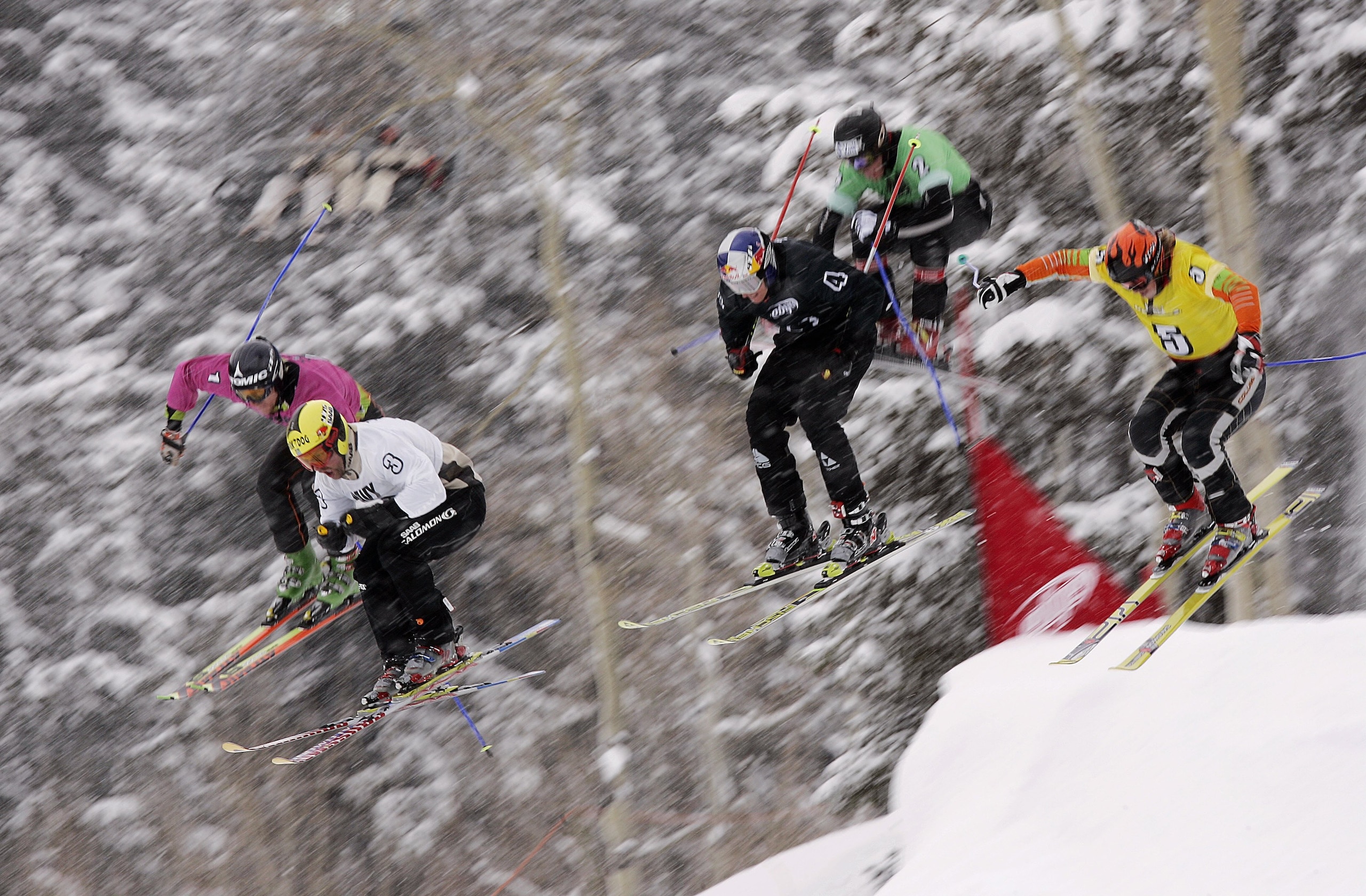 ASPEN, CO - JANUARY 29:  Lars Lewen, Reggie Crist, Chris Del Bosco, Tomas Kraus, Zach Crist and Casey Puckett take off a jump in the finals of Men's Skier X during Winter X Games 10 on January 29, 2006 at Buttermilk Mountain in Aspen, Colorado.  (Photo by