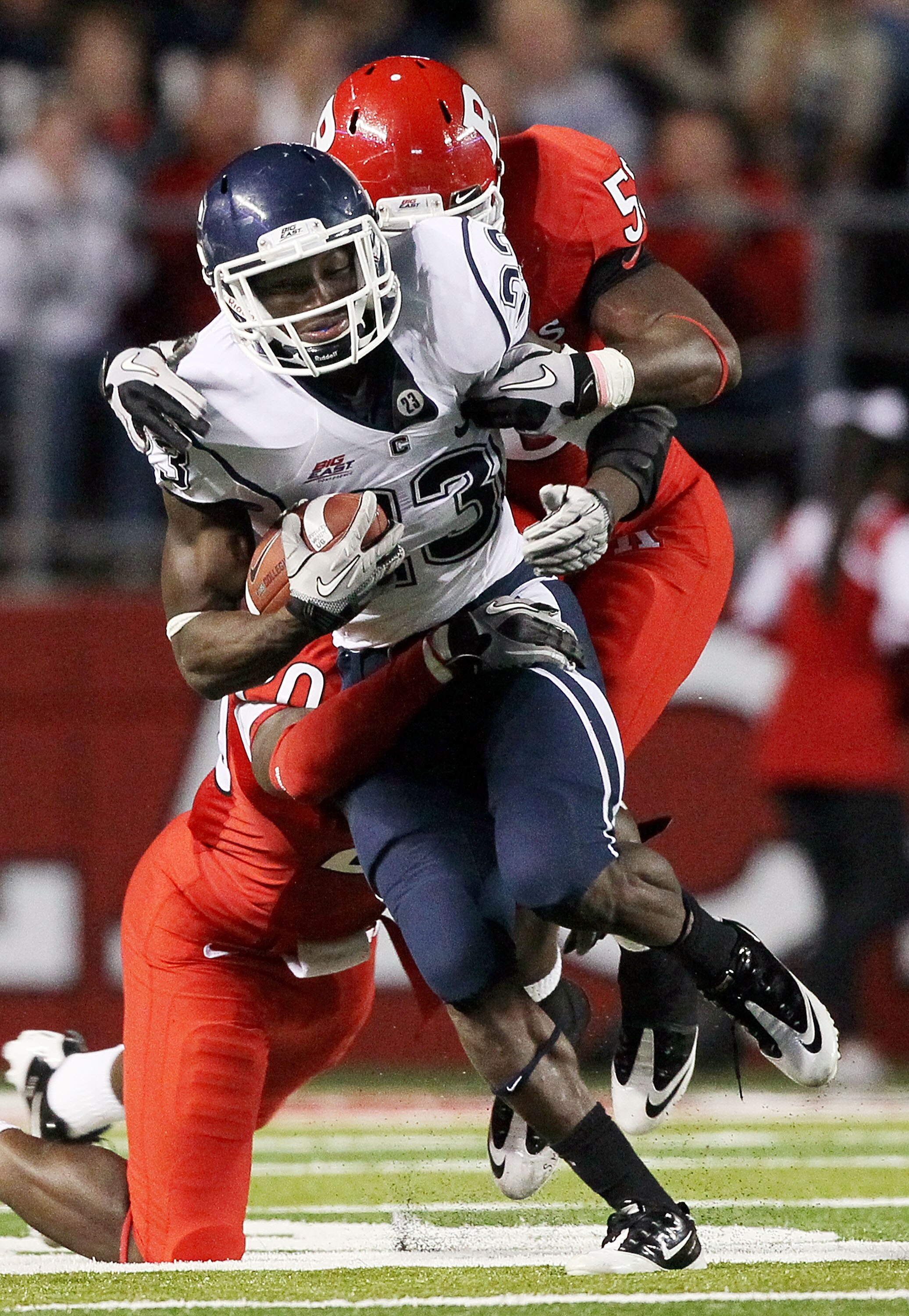 PISCATAWAY, NJ - OCTOBER 08:  Jordan Todman #23 of the Connecticut Huskies runs the ball against the Rutgers Scarlet Knights at Rutgers Stadium on October 8, 2010 in Piscataway, New Jersey. Rutgers defeated UConn 27-24.  (Photo by Jim McIsaac/Getty Images