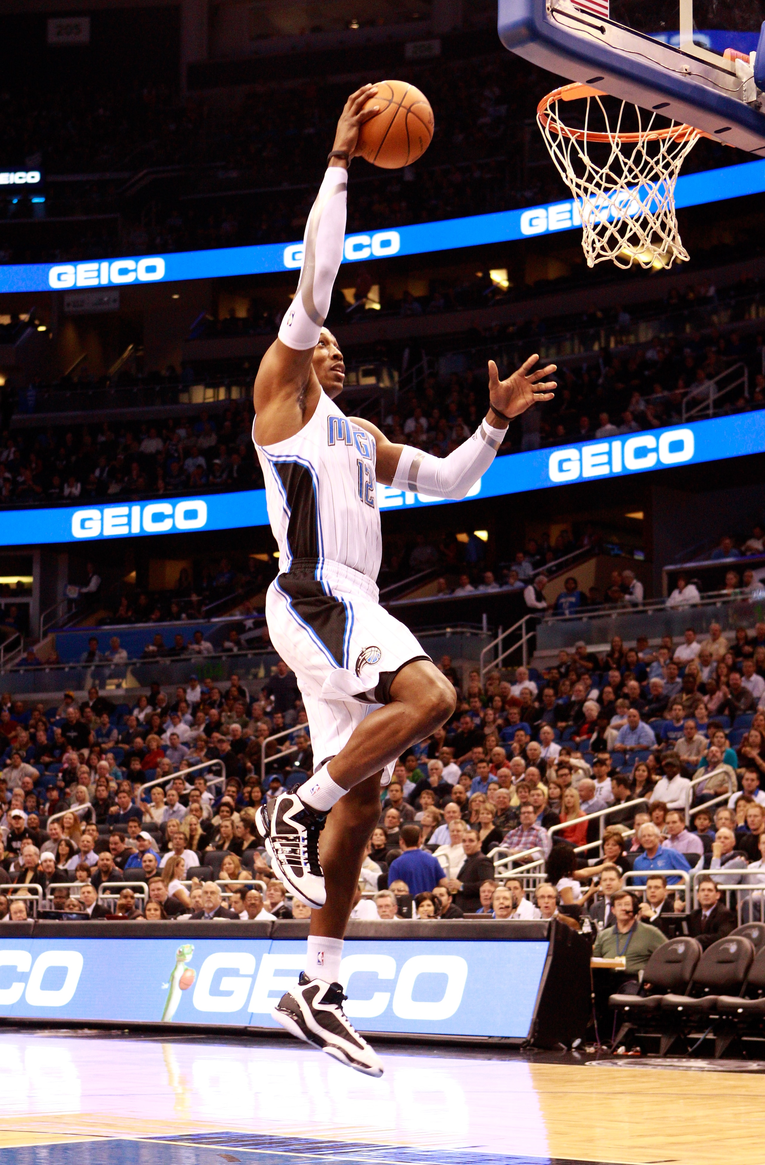 ORLANDO, FL - JANUARY 24:  Dwight Howard #12 of the Orlando Magic attempts a shot during the game against the Detroit Pistons at Amway Arena on January 24, 2011 in Orlando, Florida.  NOTE TO USER: User expressly acknowledges and agrees that, by downloadin
