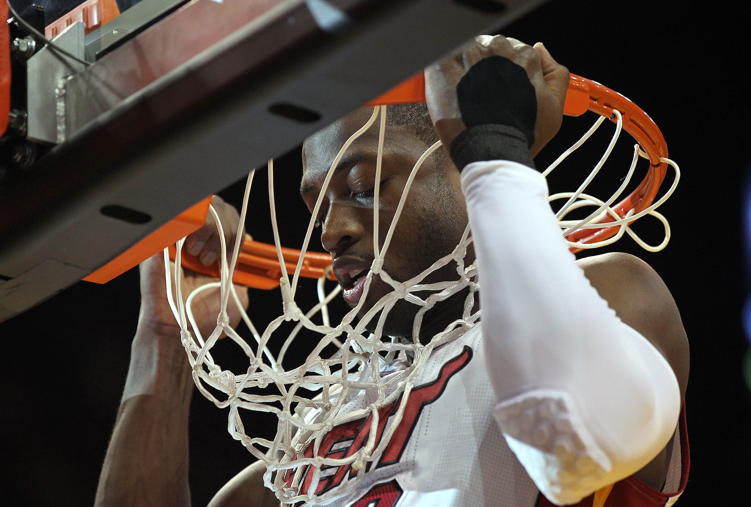 MIAMI, FL - JANUARY 18:  Dwyane Wade #3 of the Miami Heat does pullups on the rim during a game against the Atlanta Hawks at American Airlines Arena on January 18, 2011 in Miami, Florida. NOTE TO USER: User expressly acknowledges and agrees that, by downl