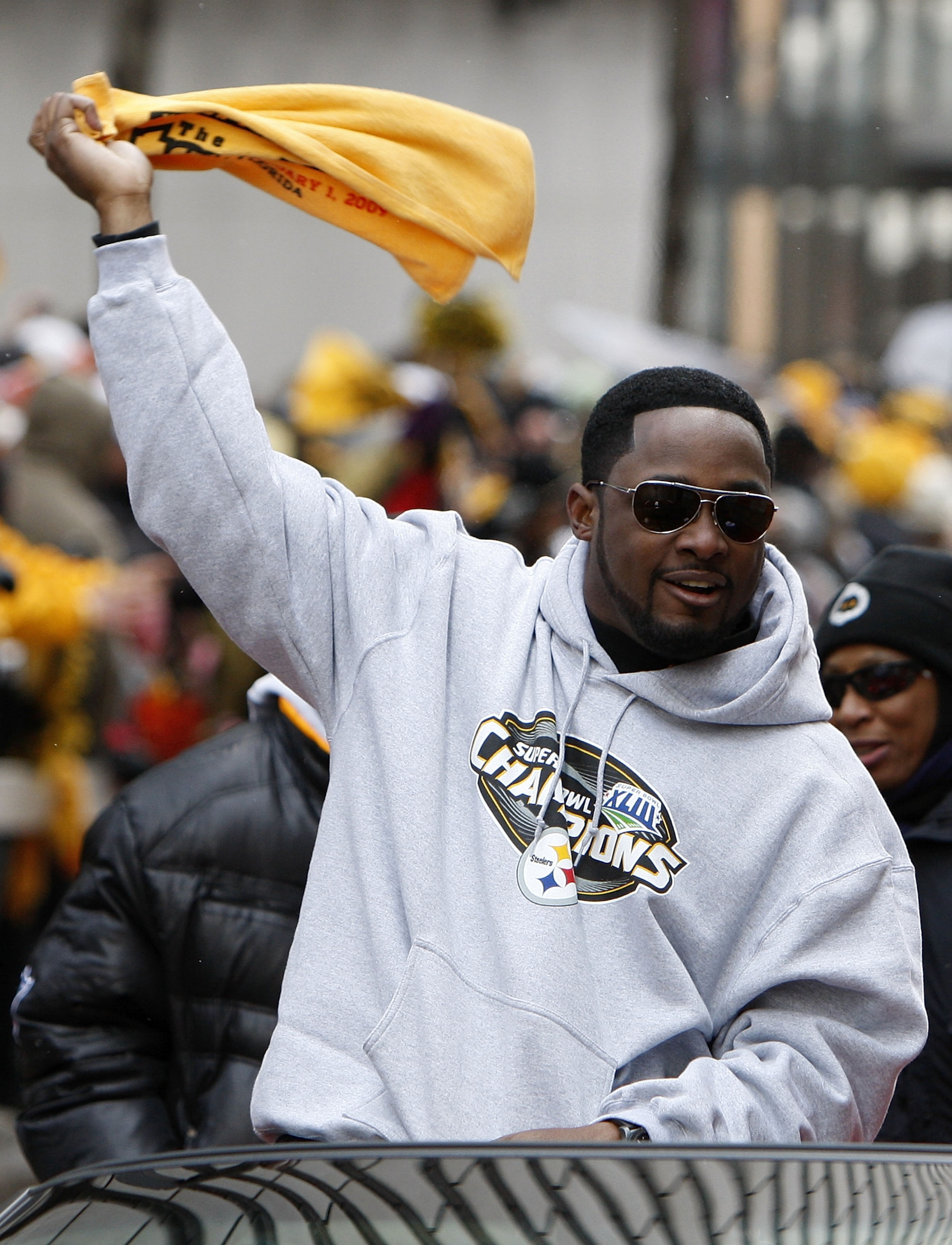PITTSBURGH - FEBRUARY 03:  Head coach Mike Tomlin of the Pittsburgh Steelers waves a terrible towel during a parade to celebrate winning Super Bowl XLIII on February 3, 2009 in Pittsburgh, Pennsylvania.  (Photo by Gregory Shamus/Getty Images)