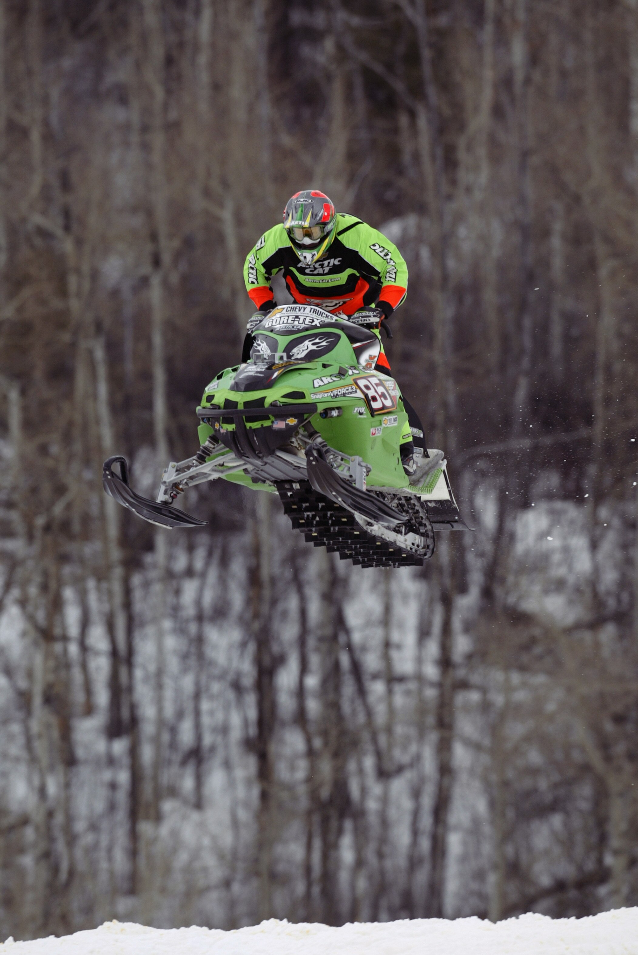 ASPEN, CO - JANUARY 30:  Tucker Hibbert of the USA flies through the air during the Snowmobile SnoCross competition of the Winter X Games VII at Buttermilk Mountain on January 30, 2003, in Aspen, Colorado. (Photo by Brian Bahr/Getty Images)