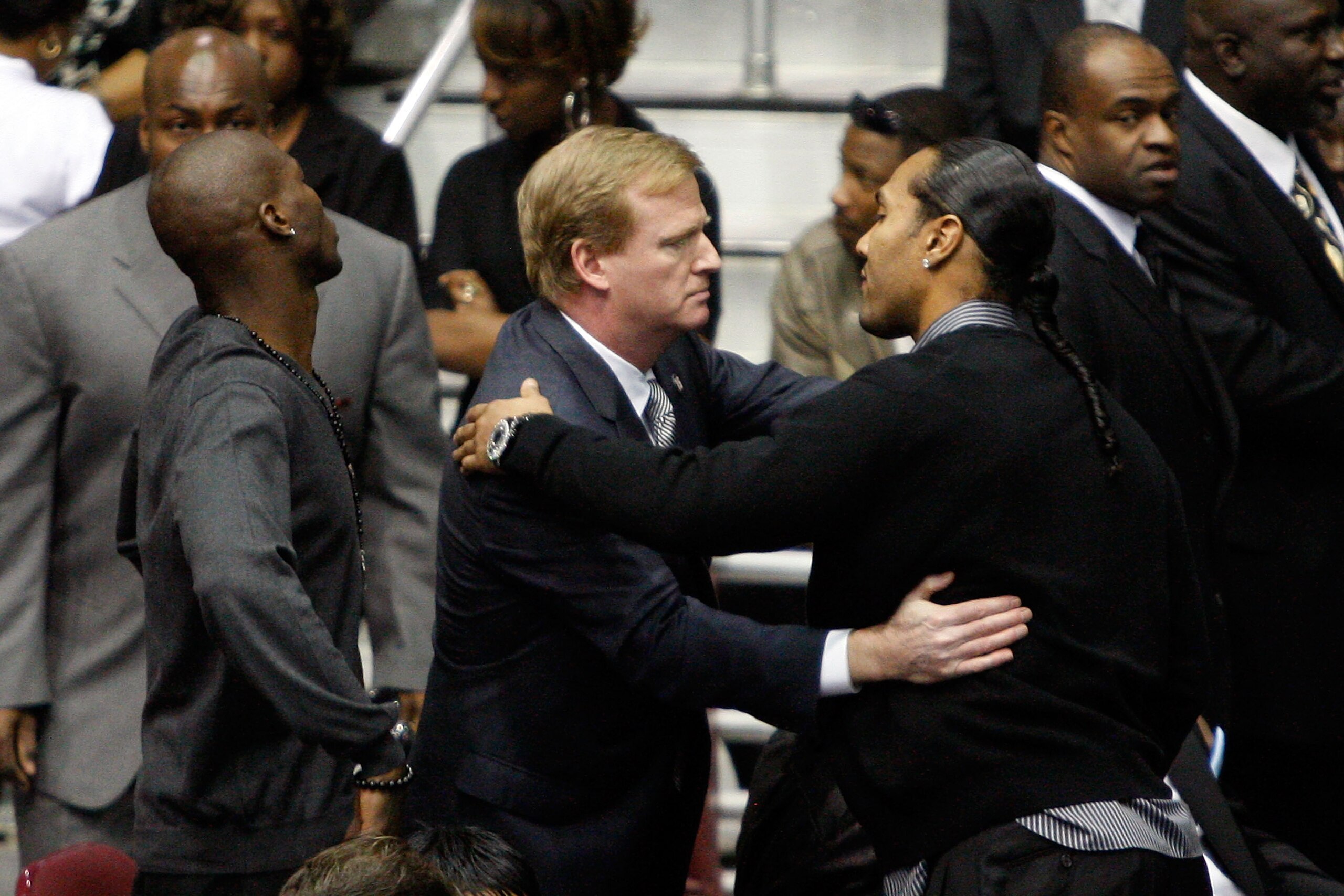 WESTWEGO, LA - DECEMBER 22:  NFL Commissioner Roger Goodell hugs Seattle Seahawks player T. J. Houshmandzadeh during the funeral for Cincinati Bengals player Chris Henry at the Alario Center  on December 22, 2009 in Westwego, Louisiana.  Henry died last w
