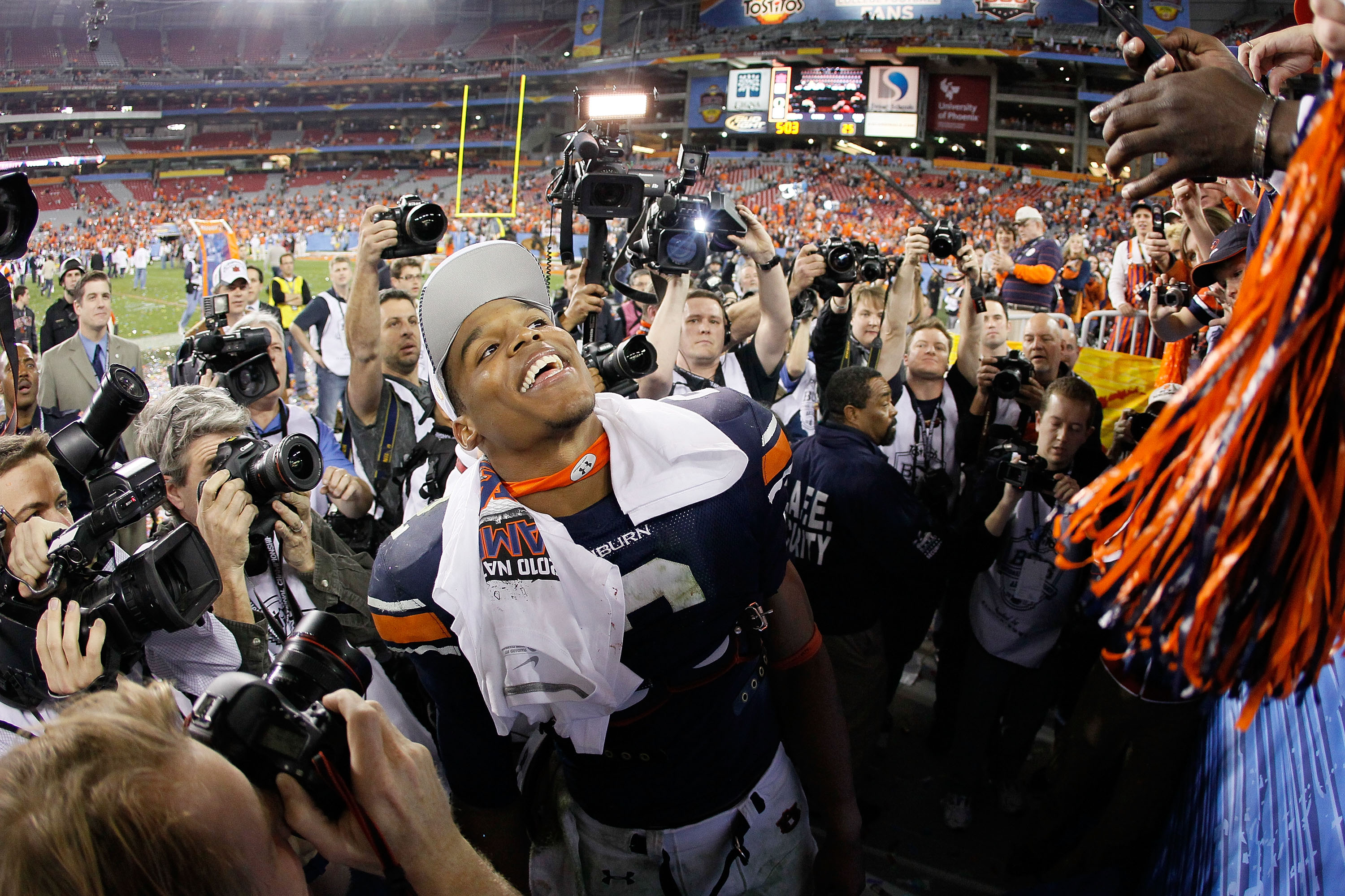 GLENDALE, AZ - JANUARY 10:  Quarterback Cameron Newton #2 of the Auburn Tigers celebrates their 22-19 victory after defeating the Oregon Ducks in the Tostitos BCS National Championship Game at University of Phoenix Stadium on January 10, 2011 in Glendale,
