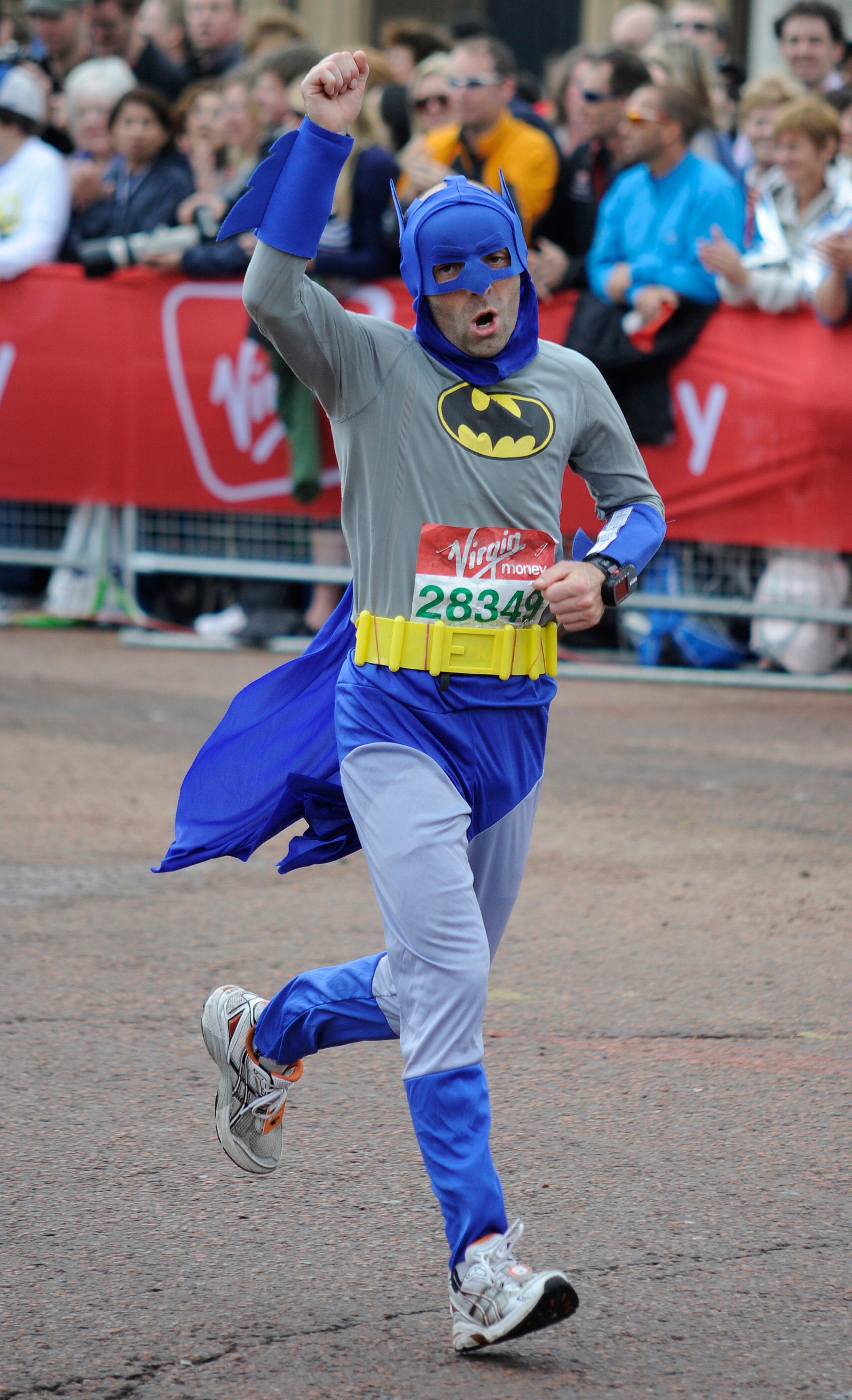LONDON, ENGLAND - APRIL 25: A man dressed as Batman' approaches the finish during the Virgin London Marathon on April 25, 2010 in London, England  (Photo by Alan Crowhurst/Getty Images)