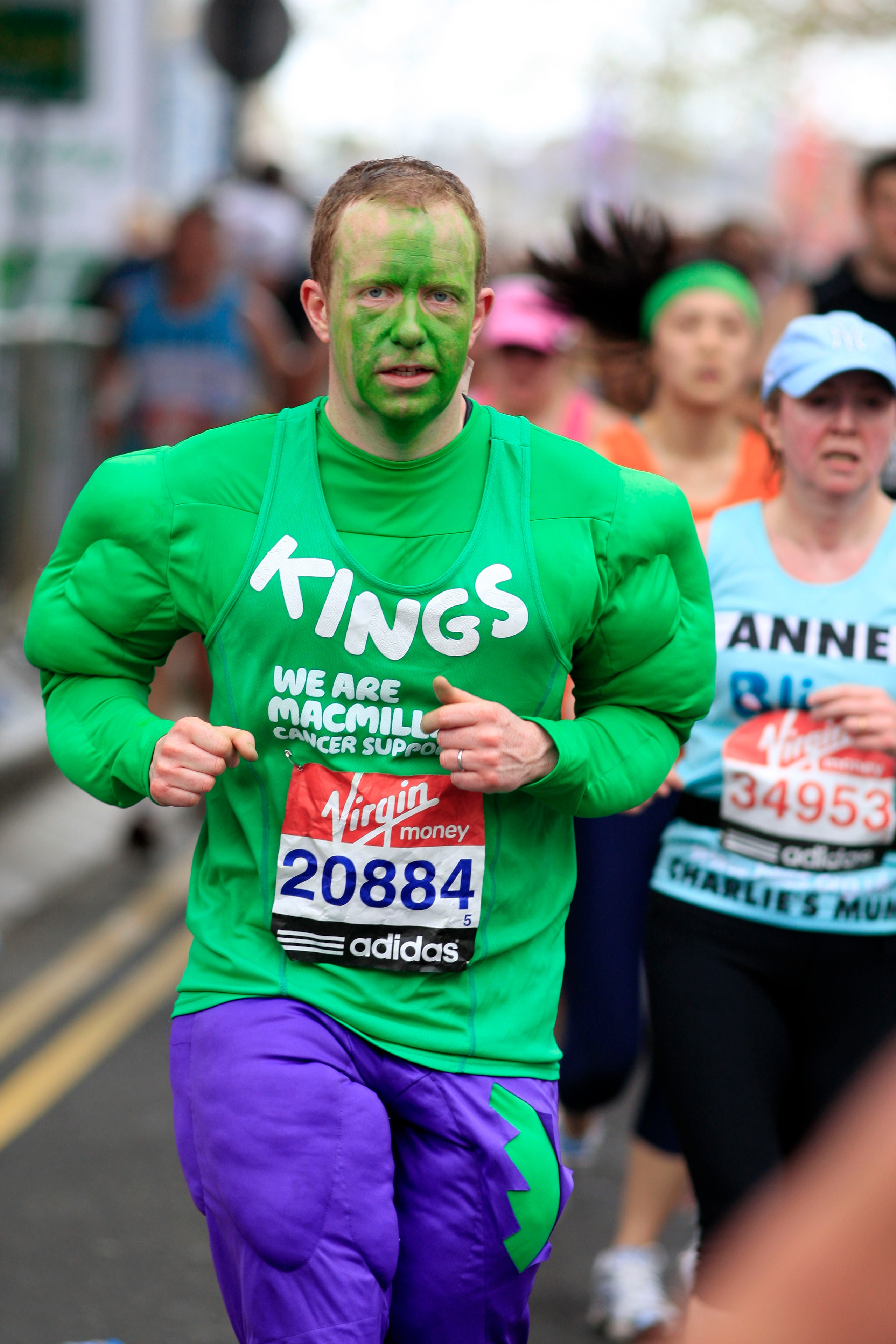 LONDON, ENGLAND - APRIL 25:  A runner dressed as the Incredible Hulk passes the 18 mile point of the race during the 2010 Virgin London Marathon on April 25, 2010 in London, England. (Photo by Jed Leicester/Getty Images)