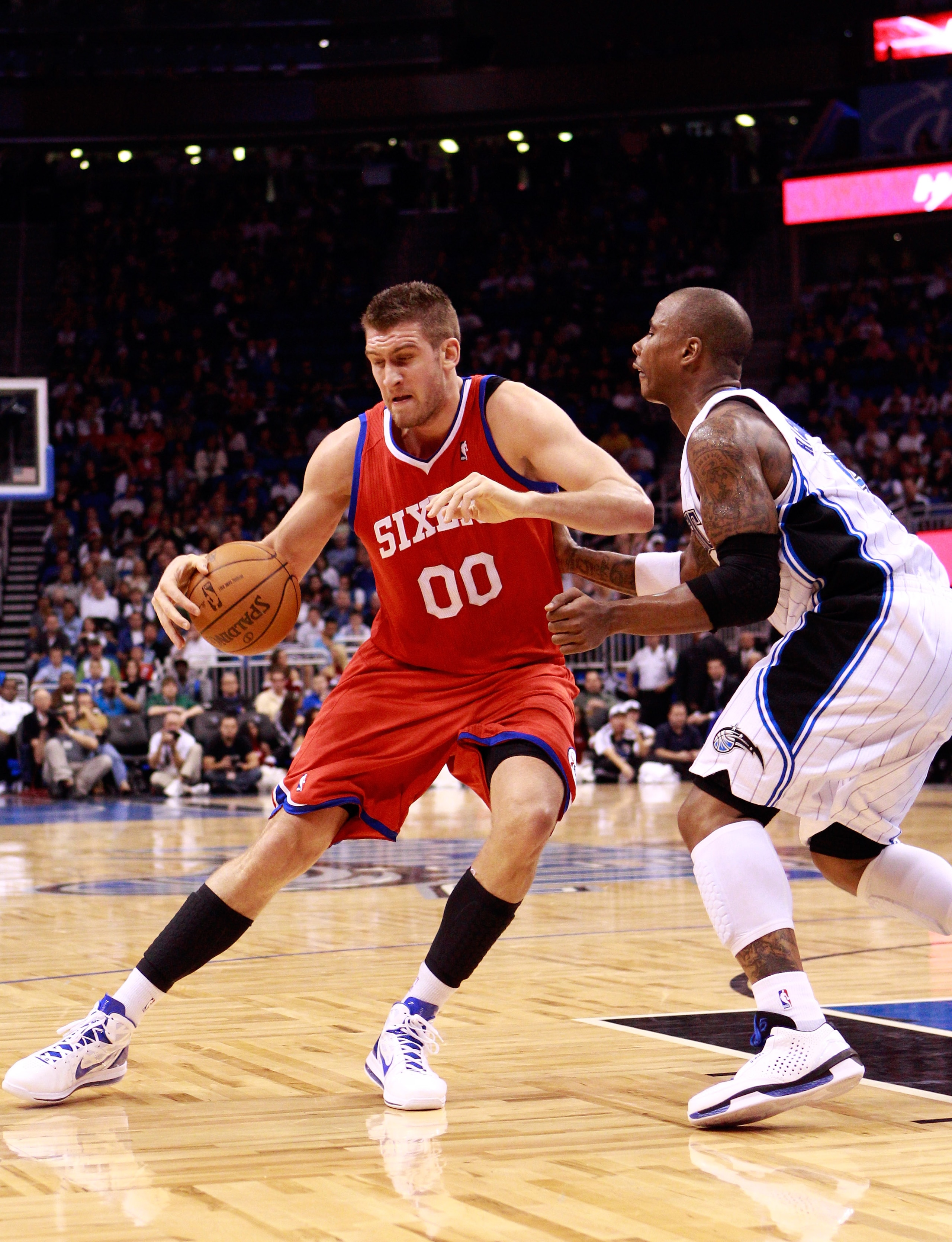 ORLANDO, FL - DECEMBER 18: Spencer Hawes #00 of the Philadelphia 76ers is guarded by Quentin Richardson #5 of the Orlando Magic during the game at Amway Arena on December 18, 2010 in Orlando, Florida. NOTE TO USER: User expressly acknowledges and agrees ORLANDO, FL - DECEMBER 18: Spencer Hawes #00 of the Philadelphia 76ers is guarded by Quentin Richardson #5 of the Orlando Magic during the game at Amway Arena on December 18, 2010 in Orlando, Florida. NOTE TO USER: User expressly acknowledges and agrees