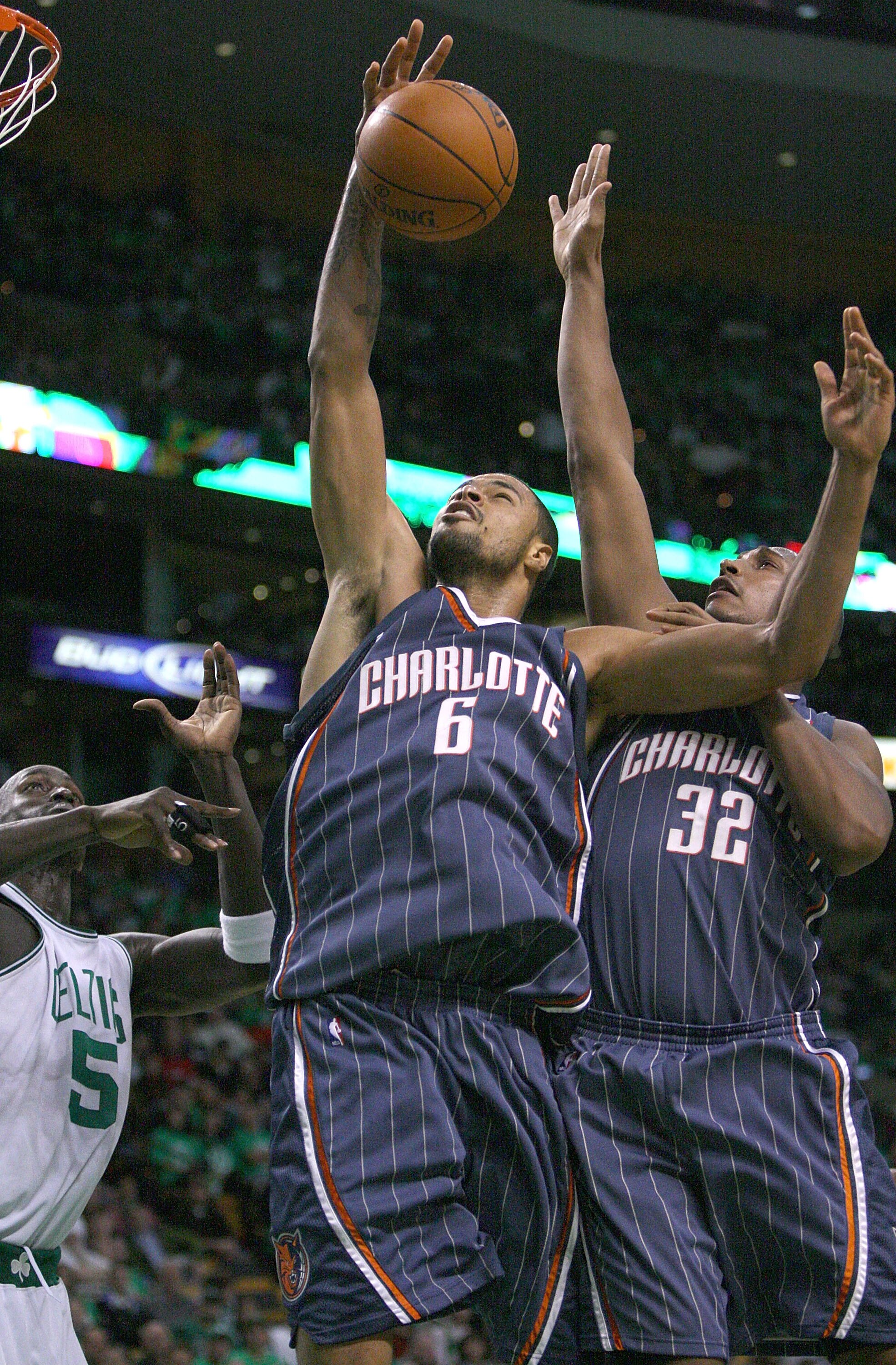 BOSTON, MA - OCTOBER 28:  Tyson Chandler #6 of the Charlotte Bobcats grabs a rebound with the help of teammate Boris Diaw #32 against the Boston Celtics at the TD Banknorth Garden on October 28, 2009 in Boston, Massachusetts. NOTE TO USER: User expressly