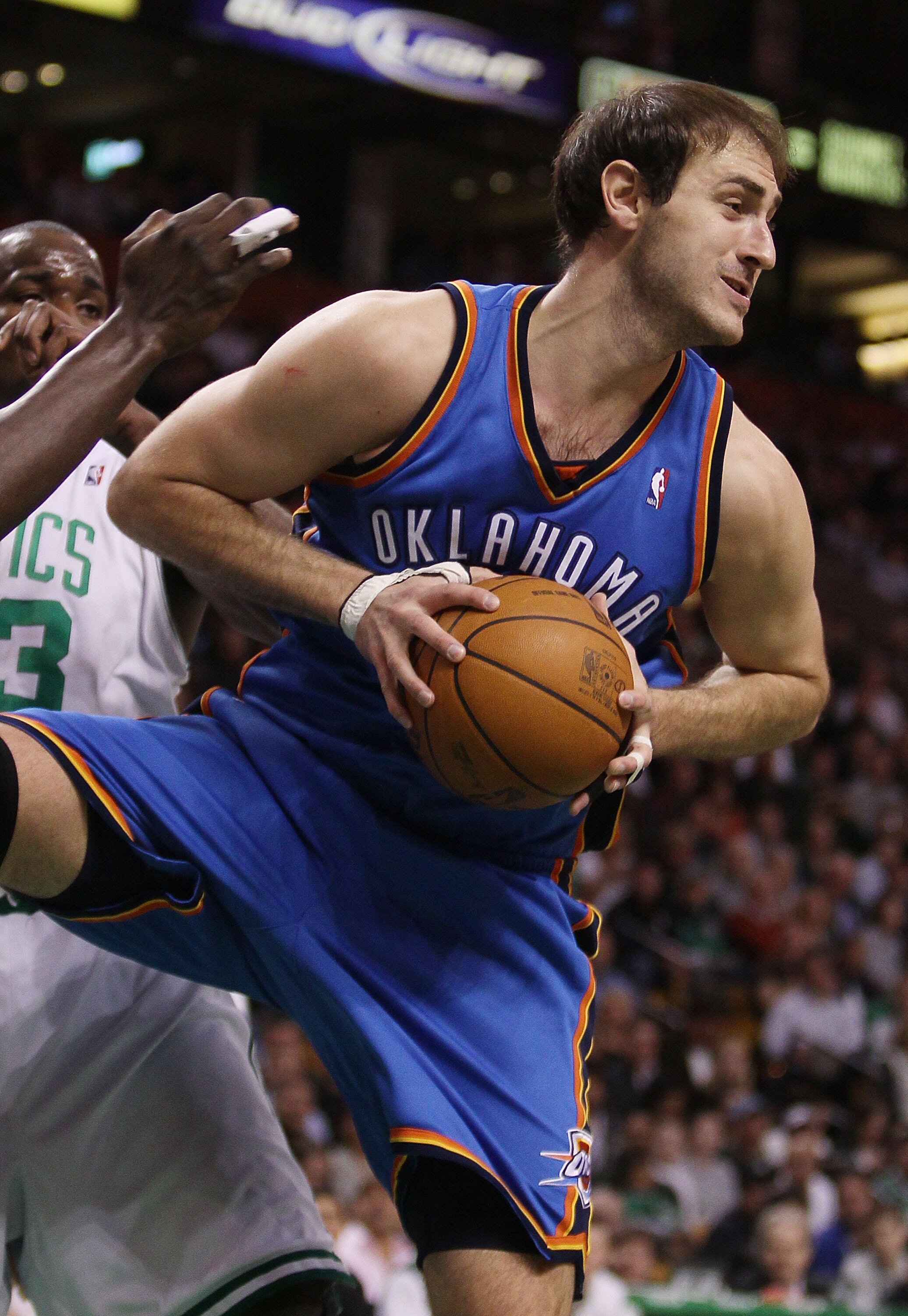 BOSTON - MARCH 31:  Nenad Krstic #12 of the Oklahoma City Thunder grabs the rebound in the first quarter against the Boston Celtics on March 31, 2010 at the TD Garden in Boston, Massachusetts.  NOTE TO USER: User expressly acknowledges and agrees that, by