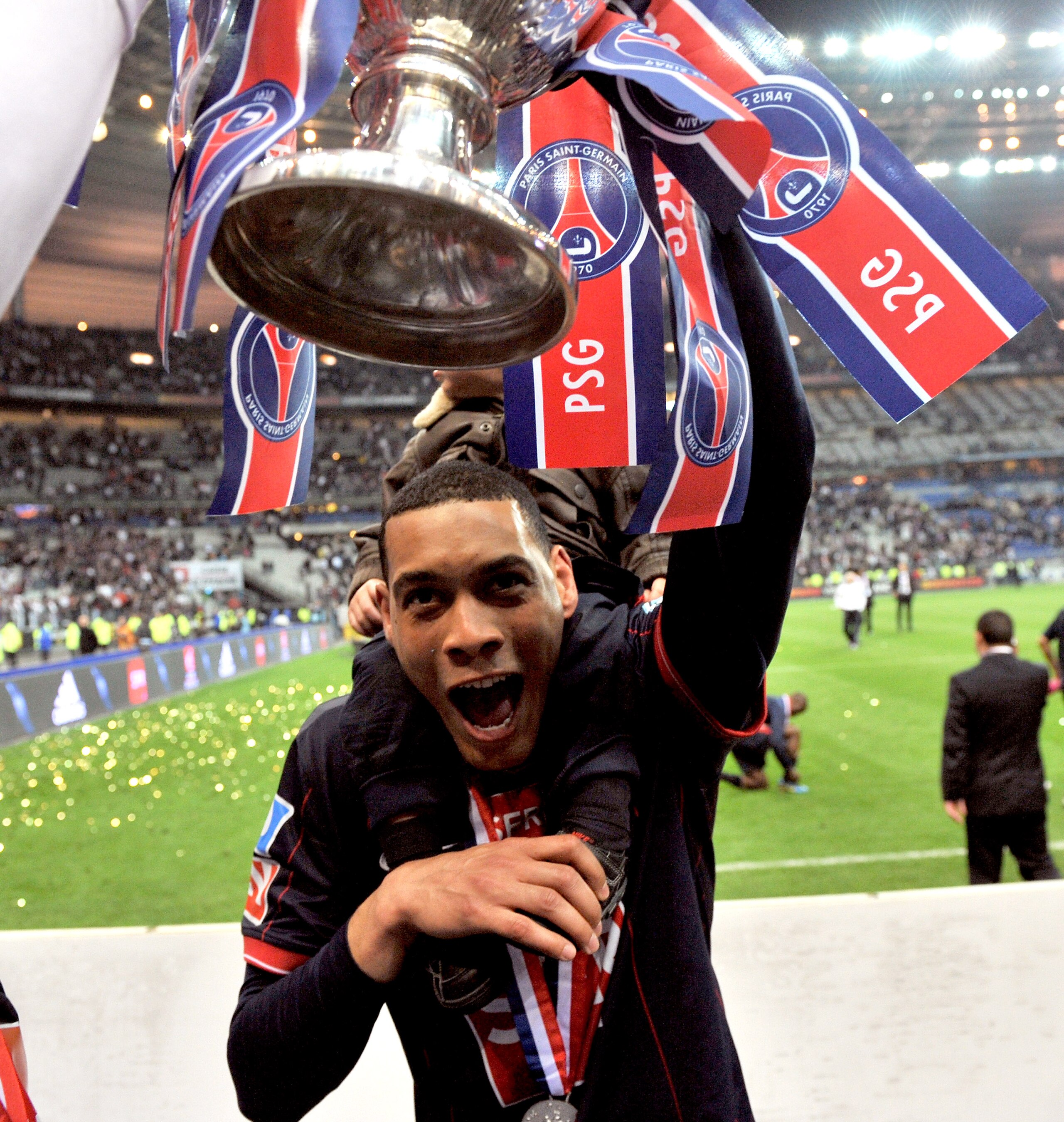 PARIS - MAY 01: Paris Saint-Germain's French striker Guillaume Hoarau holds the trophy as he celebrates the winning of the French Cup final between Paris Saint Germain football club and A.S Monaco at Stade de France on May 1, 2010 in Paris, France. Paris PARIS - MAY 01: Paris Saint-Germain's French striker Guillaume Hoarau holds the trophy as he celebrates the winning of the French Cup final between Paris Saint Germain football club and A.S Monaco at Stade de France on May 1, 2010 in Paris, France. Paris