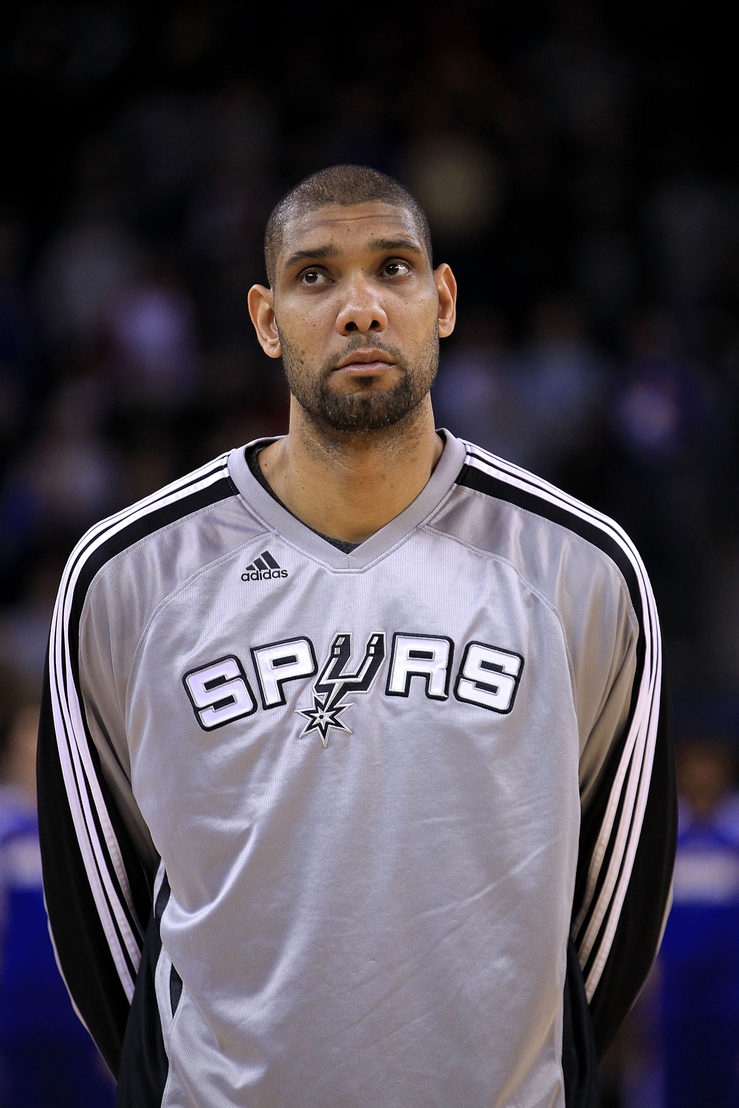 OAKLAND, CA - JANUARY 24: Tim Duncan #21 of the San Antonio Spurs stands for the National Anthem before their game against the Golden State Warriors at Oracle Arena on January 24, 2011 in Oakland, California. NOTE TO USER: User expressly acknowledges an OAKLAND, CA - JANUARY 24: Tim Duncan #21 of the San Antonio Spurs stands for the National Anthem before their game against the Golden State Warriors at Oracle Arena on January 24, 2011 in Oakland, California. NOTE TO USER: User expressly acknowledges an
