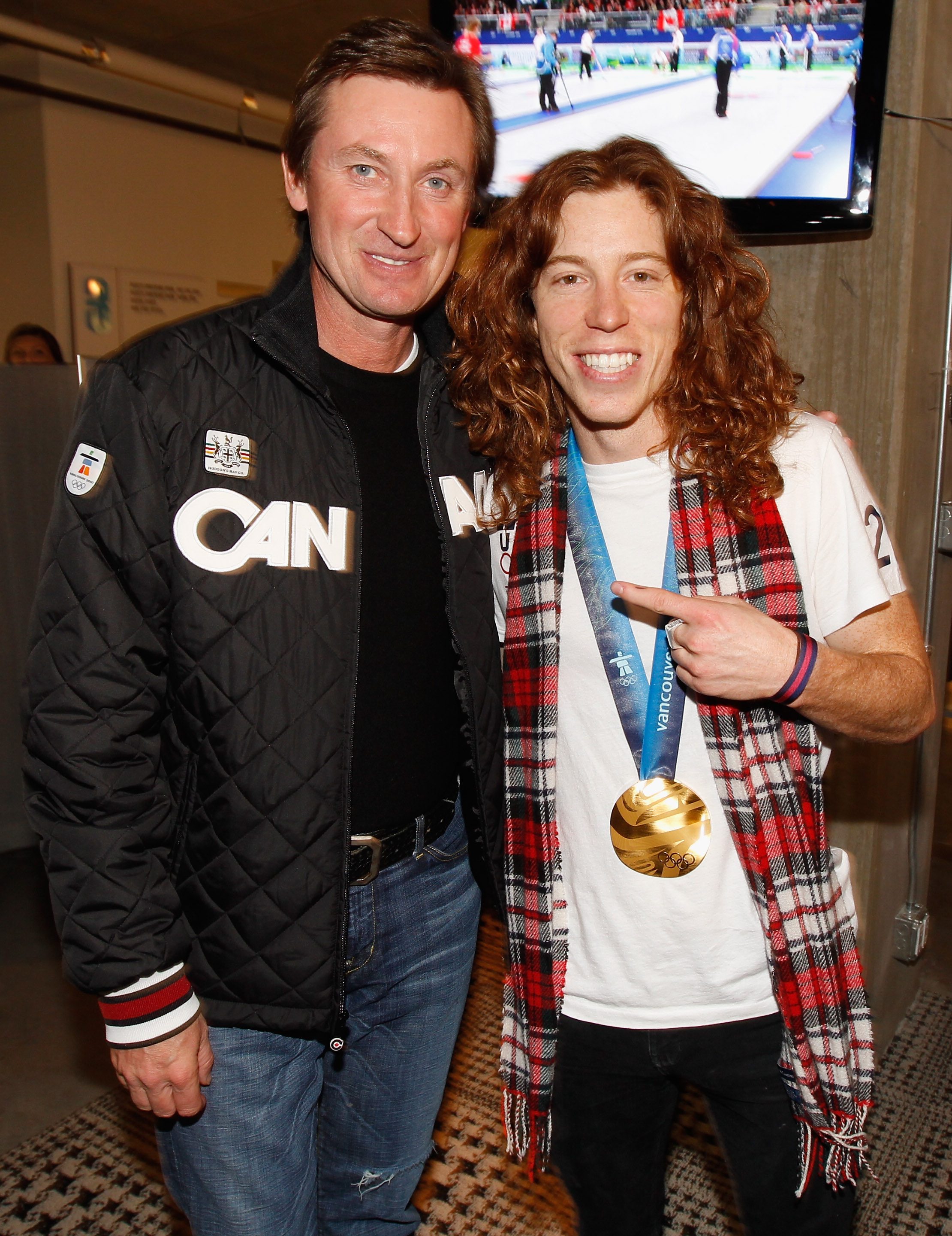 VANCOUVER, BC - FEBRUARY 18:  Shaun White of the United States poses with his men's halfpipe Olympic gold medal and hockey great Wayne Gretzky at the USA House on February 18, 2010 in Vancouver, Canada.  (Photo by Christopher Polk/Getty Images)