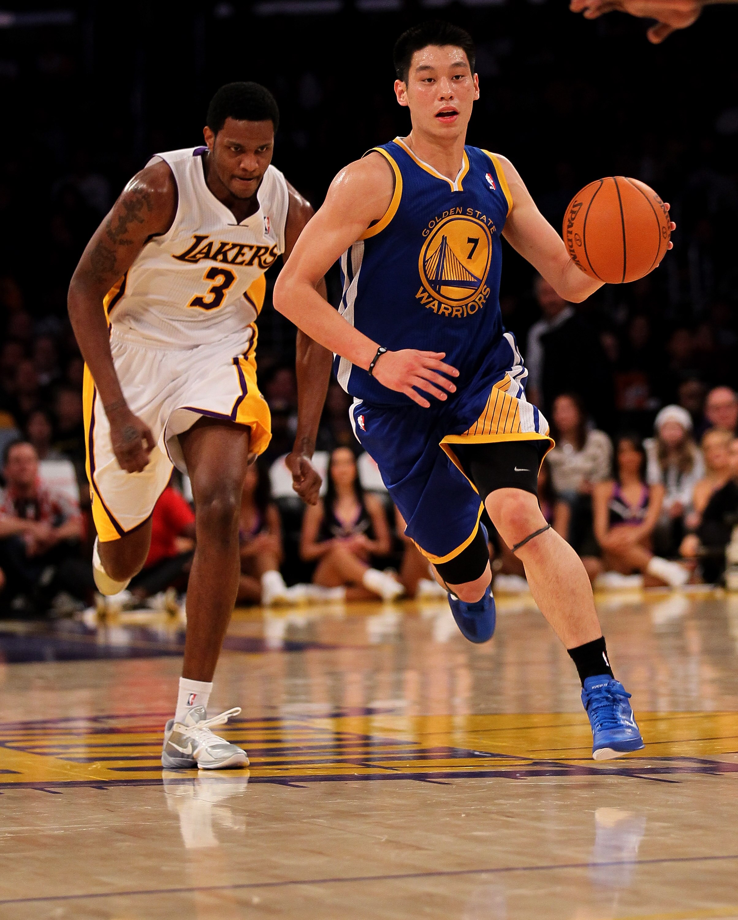 LOS ANGELES, CA - NOVEMBER 21:  Jeremy Lin #7 of the Golden State Warriors drives ahead of Devin Ebanks #3 of the Los Angeles Lakers at Staples Center on November 21, 2010 in Los Angeles, California.   The Lakers won 117-89. NOTE TO USER: User expressly a