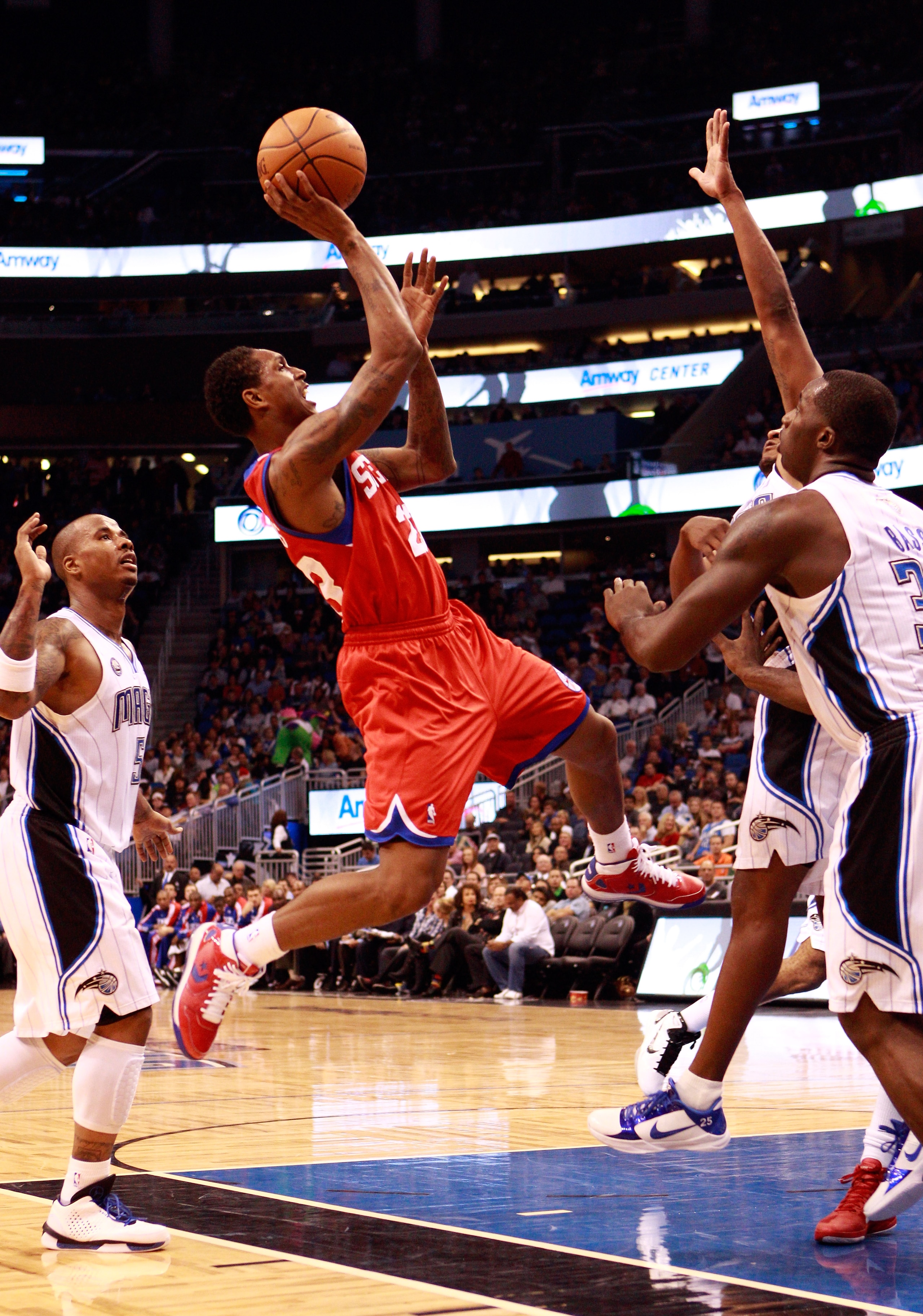 ORLANDO, FL - DECEMBER 18:  Louis Williams #23 of the Philadelphia 76ers attempts a shot during the game against the Orlando Magic at Amway Arena on December 18, 2010 in Orlando, Florida.  NOTE TO USER: User expressly acknowledges and agrees that, by down