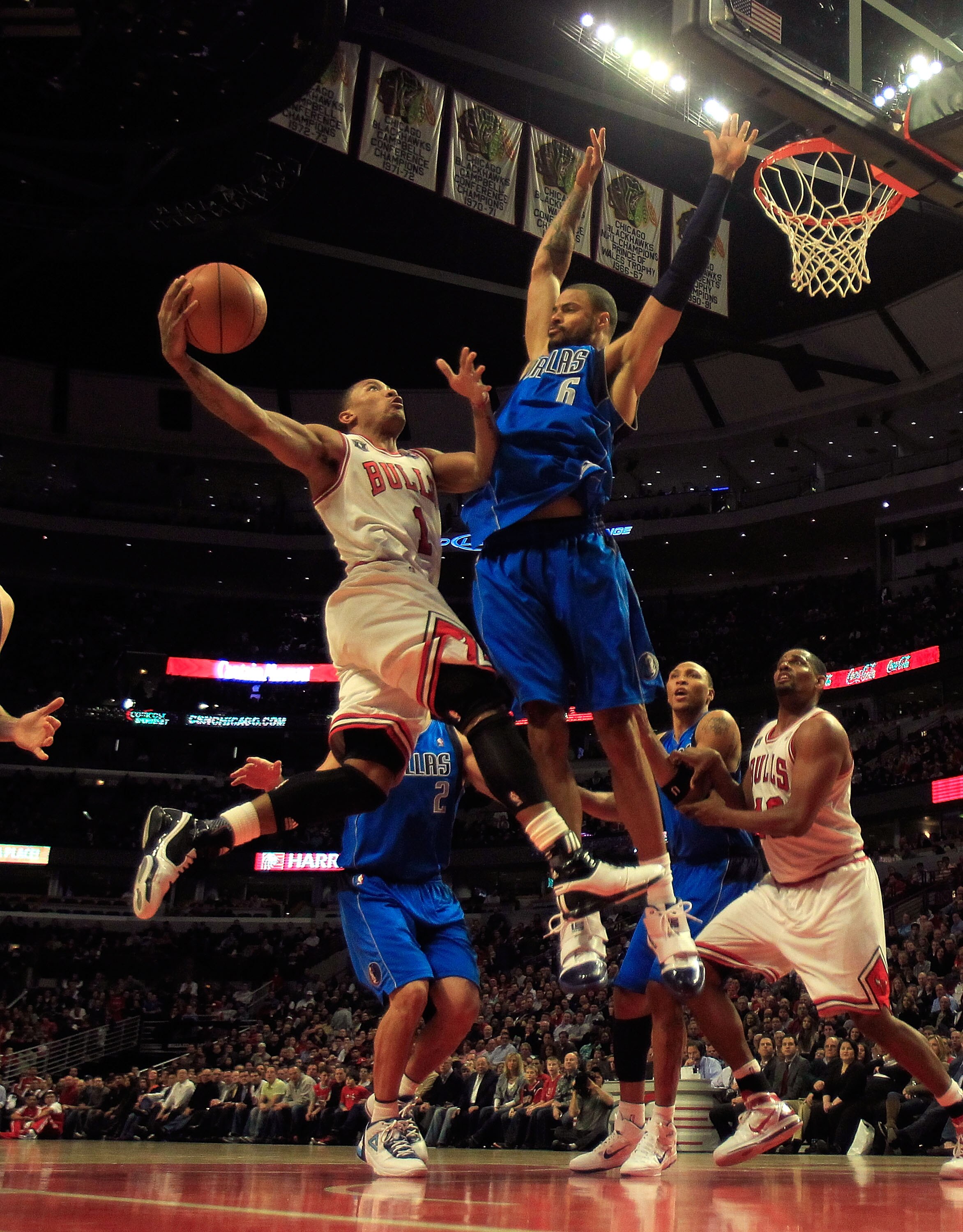 CHICAGO, IL - JANUARY 20: Derrick Rose #1 of the Chicago Bulls goes up for a shot against Tyson Chandler #6 of the Dallas Mavericks at the United Center on January 20, 2011 in Chicago, Illinois. The Bulls defeated the Mavericks 82-77. NOTE TO USER: User e
