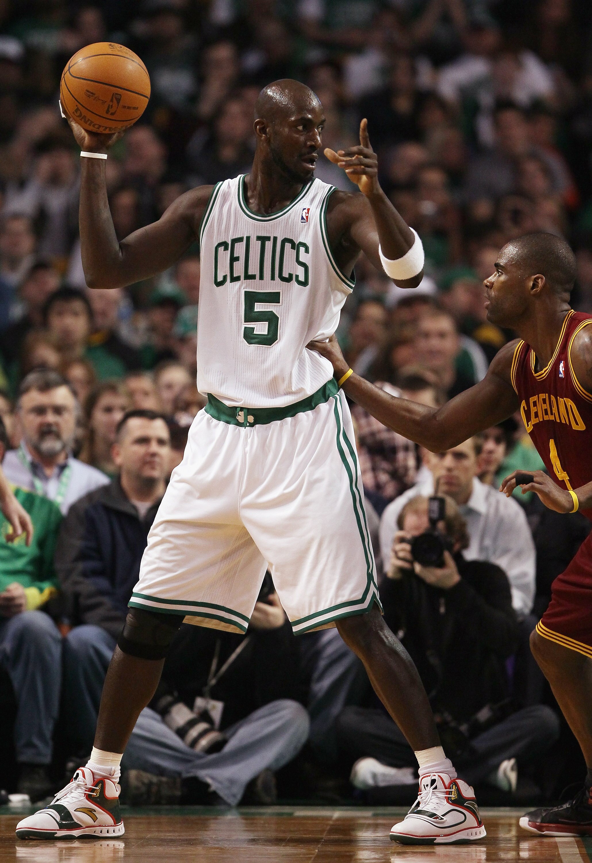 BOSTON, MA - JANUARY 25:  Kevin Garnett #5 of the Boston Celtics directs his teammates as Antawn Jamison #4 of the Cleveland Cavaliers defends on January 25, 2011 at the TD Garden in Boston, Massachusetts.   NOTE TO USER: User expressly acknowledges and a