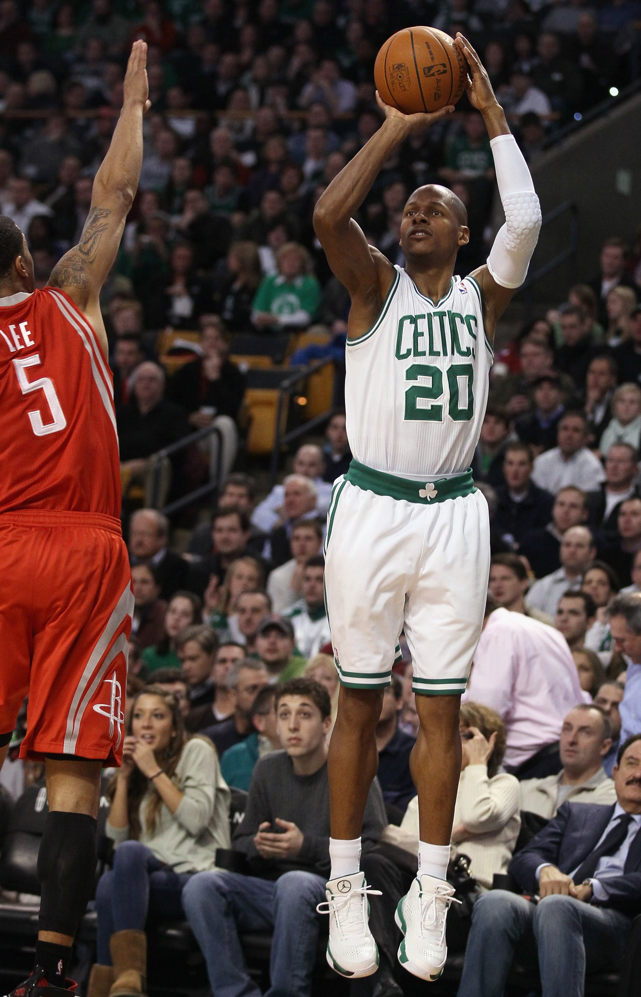 BOSTON, MA - JANUARY 10:  Ray Allen #30 of the Boston Celtics shoots a three point shot as Courtney Lee #5 of the Houston Rockets defends on January 10, 2011 at the TD Garden in Boston, Massachusetts.  NOTE TO USER: User expressly acknowledges and agrees 