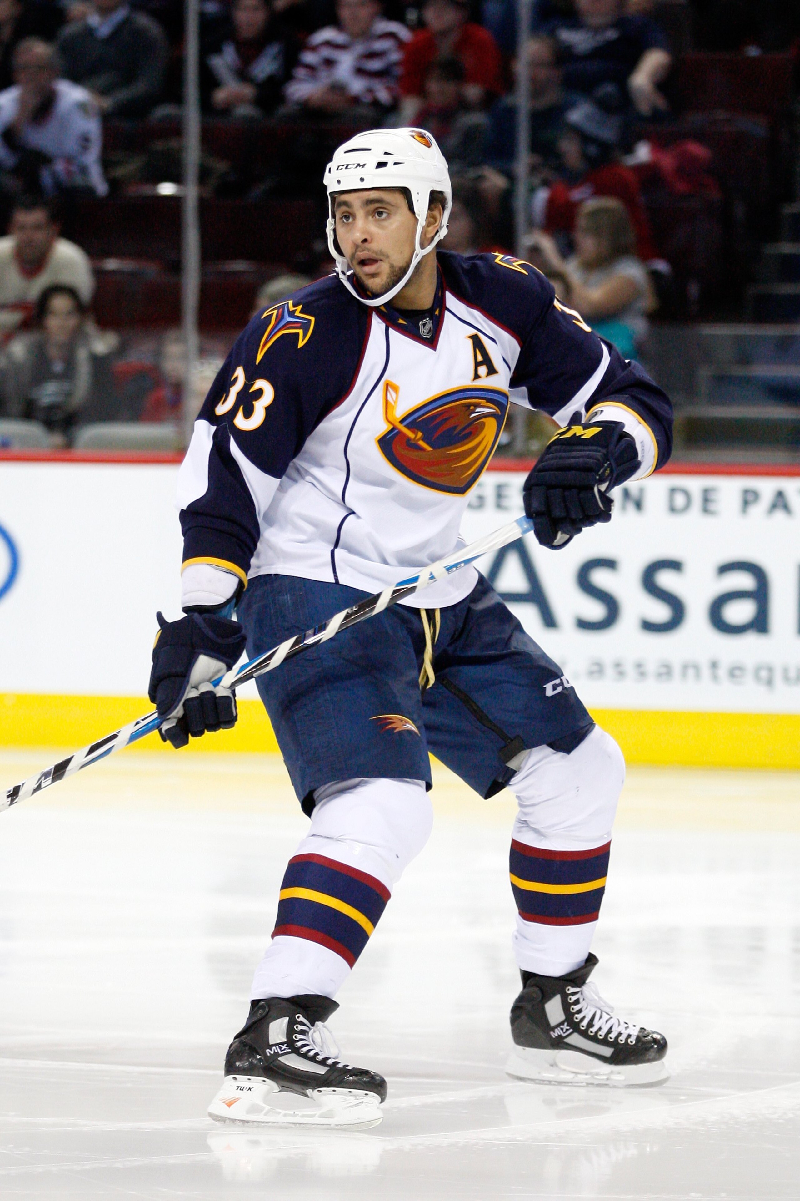 MONTREAL, CANADA - JANUARY 2:  Dustin Byfuglien #33 of the Atlanta Thrashers skates during the NHL game against the Montreal Canadiens at the Bell Centre on January 2, 2011 in Montreal, Quebec, Canada.  The Thrashers defeated the Canadiens 4-3 in overtime