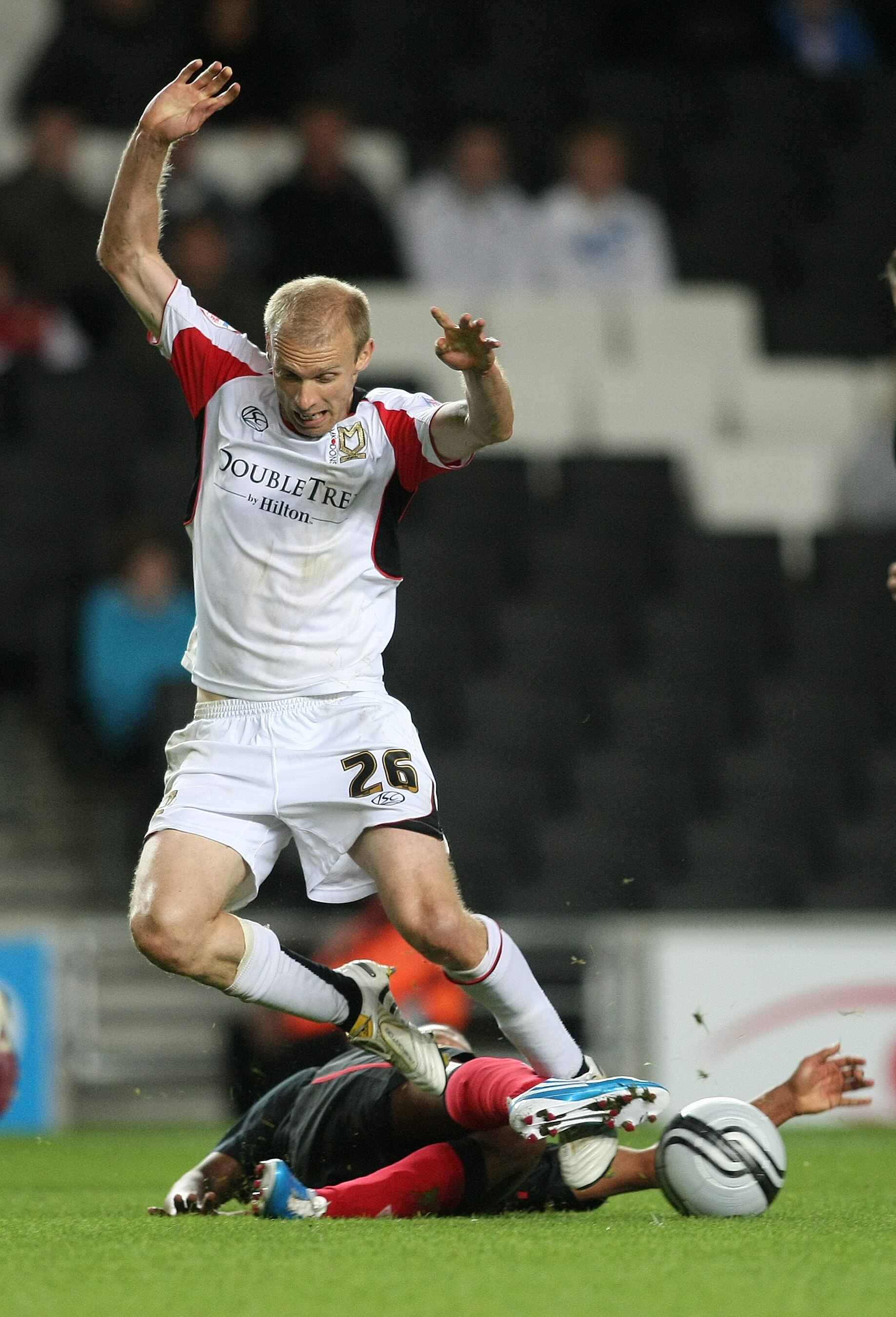 MILTON KEYNES, ENGLAND - SEPTEMBER 15:  Luke Chadwick of MK Dons is tackled by Alex Oxlade-Chamberlain of Southampton during the npower League One match between MK Dons and Southampton at Stadium:mk on September 15, 2010 in Milton Keynes, England. (Photo 