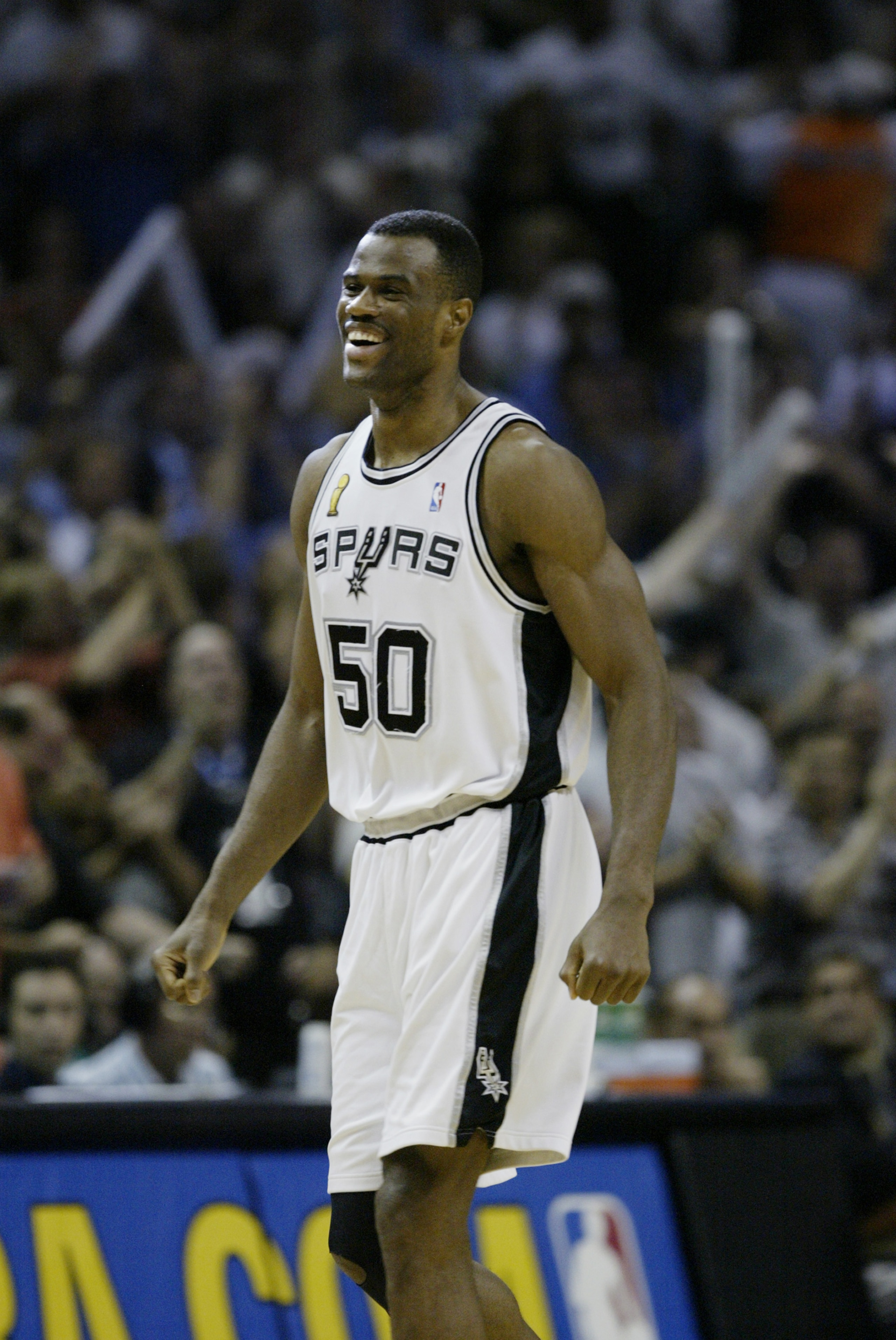 SAN ANTONIO, TX - JUNE 15:  David Robinson #50 of the San Antonio Spurs celebrates in game six of the 2003 NBA Finals against the New Jersey Nets on June 15, 2003 at the SBC Center in San Antonio, Texas.  The Spurs won 88-77 and defeated the Nets to win t