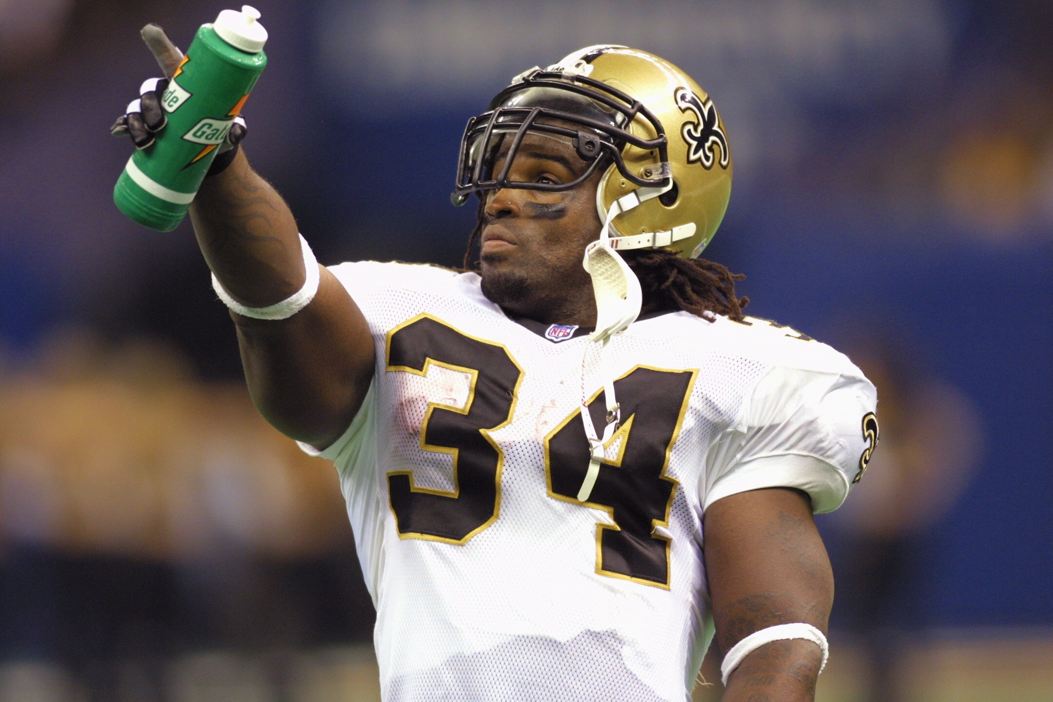 7 Oct 2001: Ricky Williams #34 of the New Orleans Saints points to the scoreboard during the game against the Minnesota Vikings at the Superdome in New Orleans, Louisiana. The Saints won 28-15. DIGITAL IMAGE. Mandatory Credit: Ronald Martinez/ALLSPORT