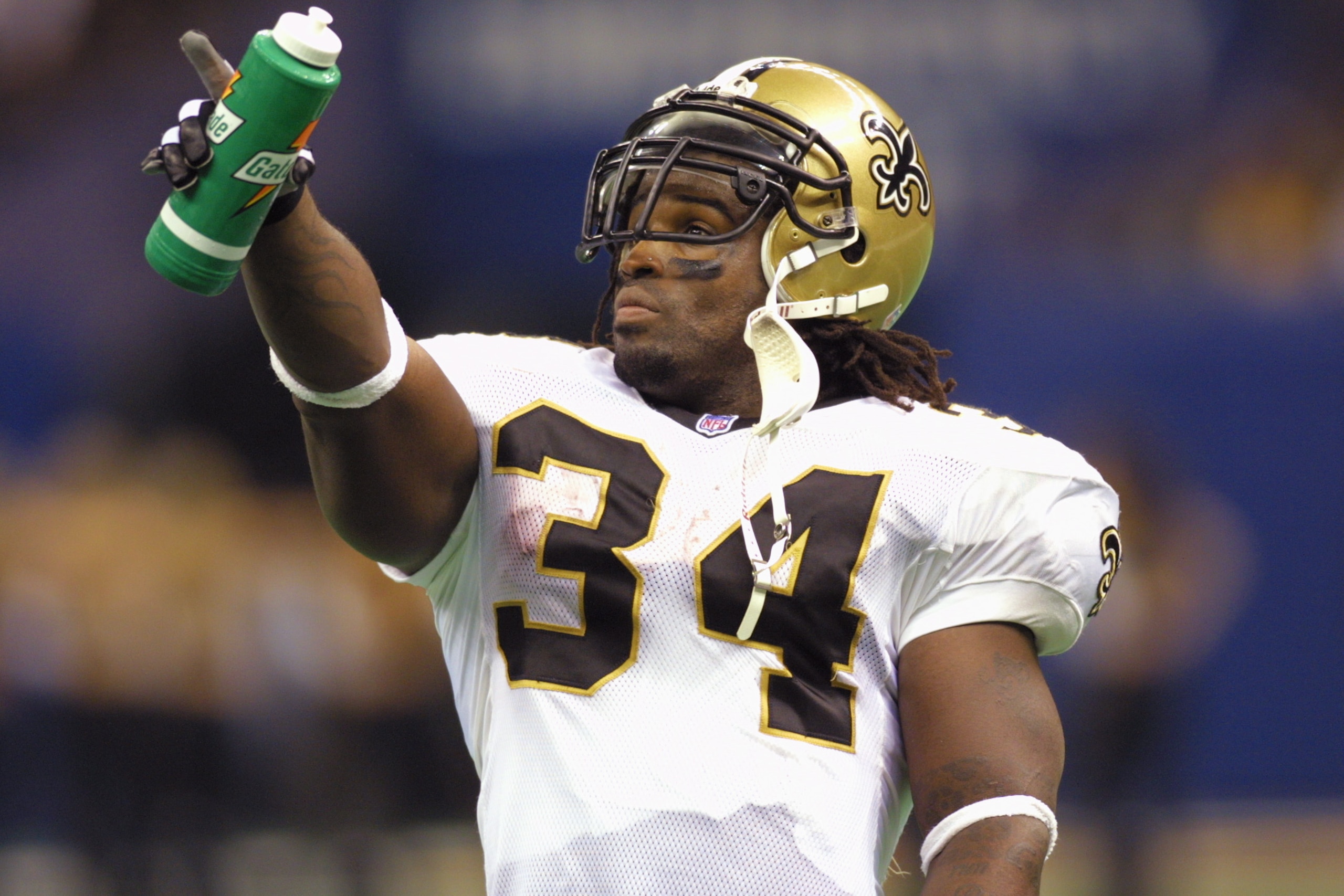 7 Oct 2001: Ricky Williams #34 of the New Orleans Saints points to the scoreboard during the game against the Minnesota Vikings at the Superdome in New Orleans, Louisiana. The Saints won 28-15. DIGITAL IMAGE. Mandatory Credit: Ronald Martinez/ALLSPORT