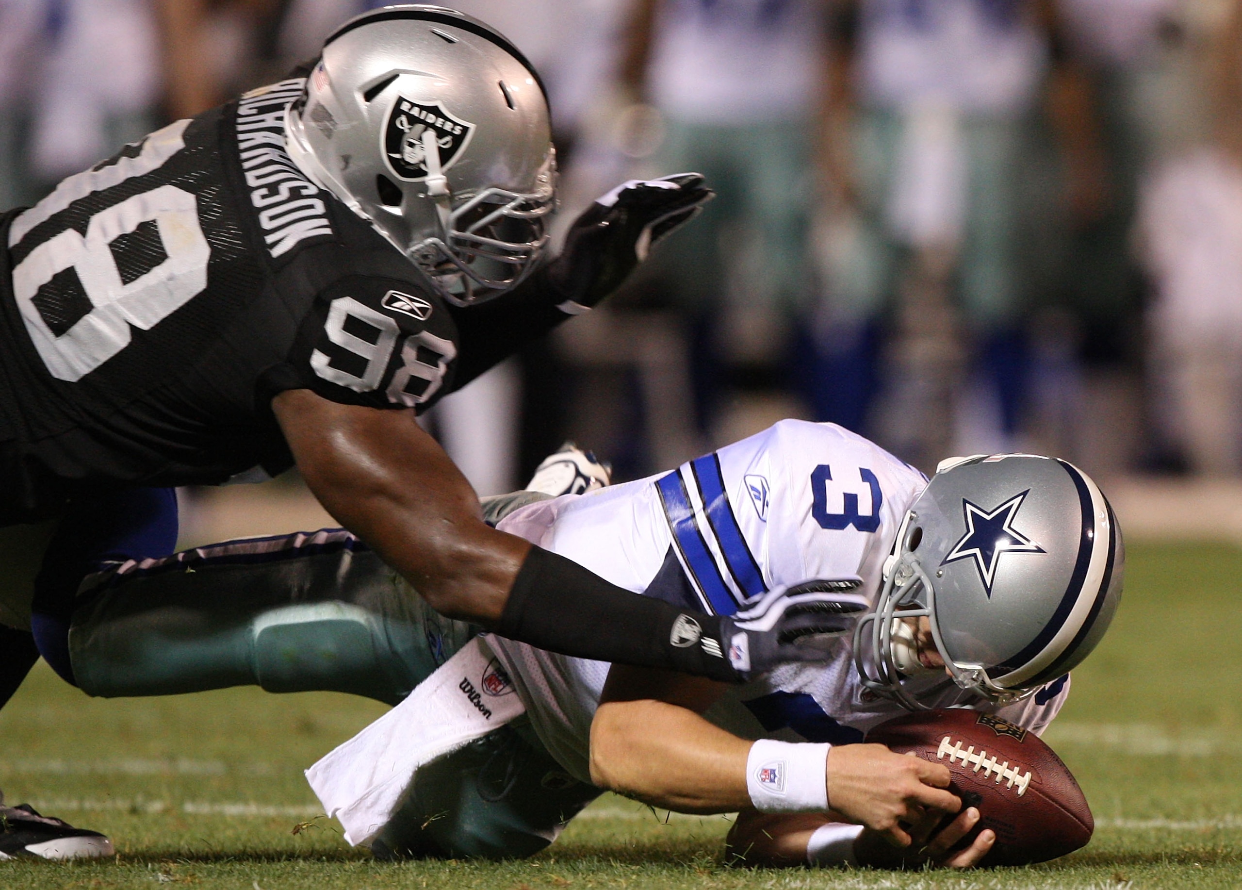 OAKLAND, CA - AUGUST 13: Defensive end Jay Richardson #98 of the Oakland Raiders sacks quarterback Jon Kitna #3 of the Dallas Cowboys after a bad snap during the preseason game at Oakland-Alameda County Coliseum on August 13, 2009 in Oakland, California. OAKLAND, CA - AUGUST 13: Defensive end Jay Richardson #98 of the Oakland Raiders sacks quarterback Jon Kitna #3 of the Dallas Cowboys after a bad snap during the preseason game at Oakland-Alameda County Coliseum on August 13, 2009 in Oakland, California.